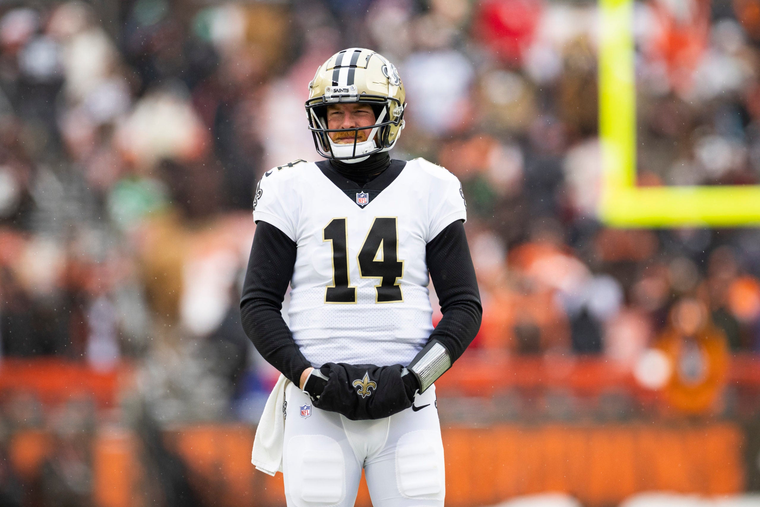 Dec 24, 2022; Cleveland, Ohio, USA; New Orleans Saints quarterback Andy Dalton (14) looks toward the sideline during a timeout during the second quarter against the Cleveland Browns at FirstEnergy Stadium. Mandatory Credit: Scott Galvin-USA TODAY Sports