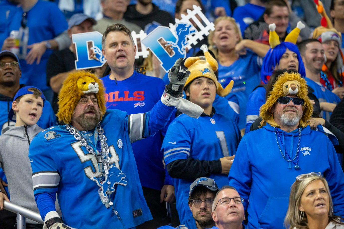Nov 24, 2022; Detroit, Michigan, USA; Some Detroit Lions fans cheer for their team during the second half against the Buffalo Bills at Ford Field. Mandatory Credit: David Reginek-USA TODAY Sports