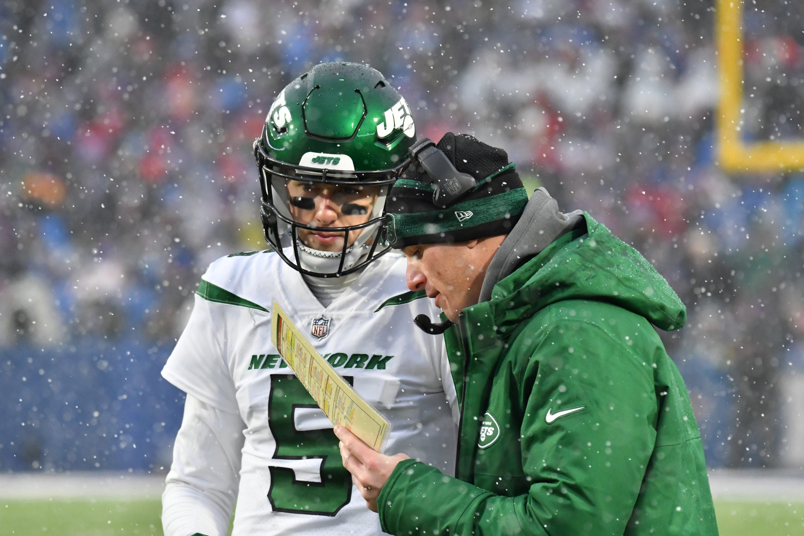 Dec 11, 2022; Orchard Park, New York, USA; New York Jets offensive coordinator Mike LaFleur talks with quarterback Mike White (5) during a timeout in the fourth quarter game against the Buffalo Bills at Highmark Stadium. Mandatory Credit: Mark Konezny-USA TODAY Sports