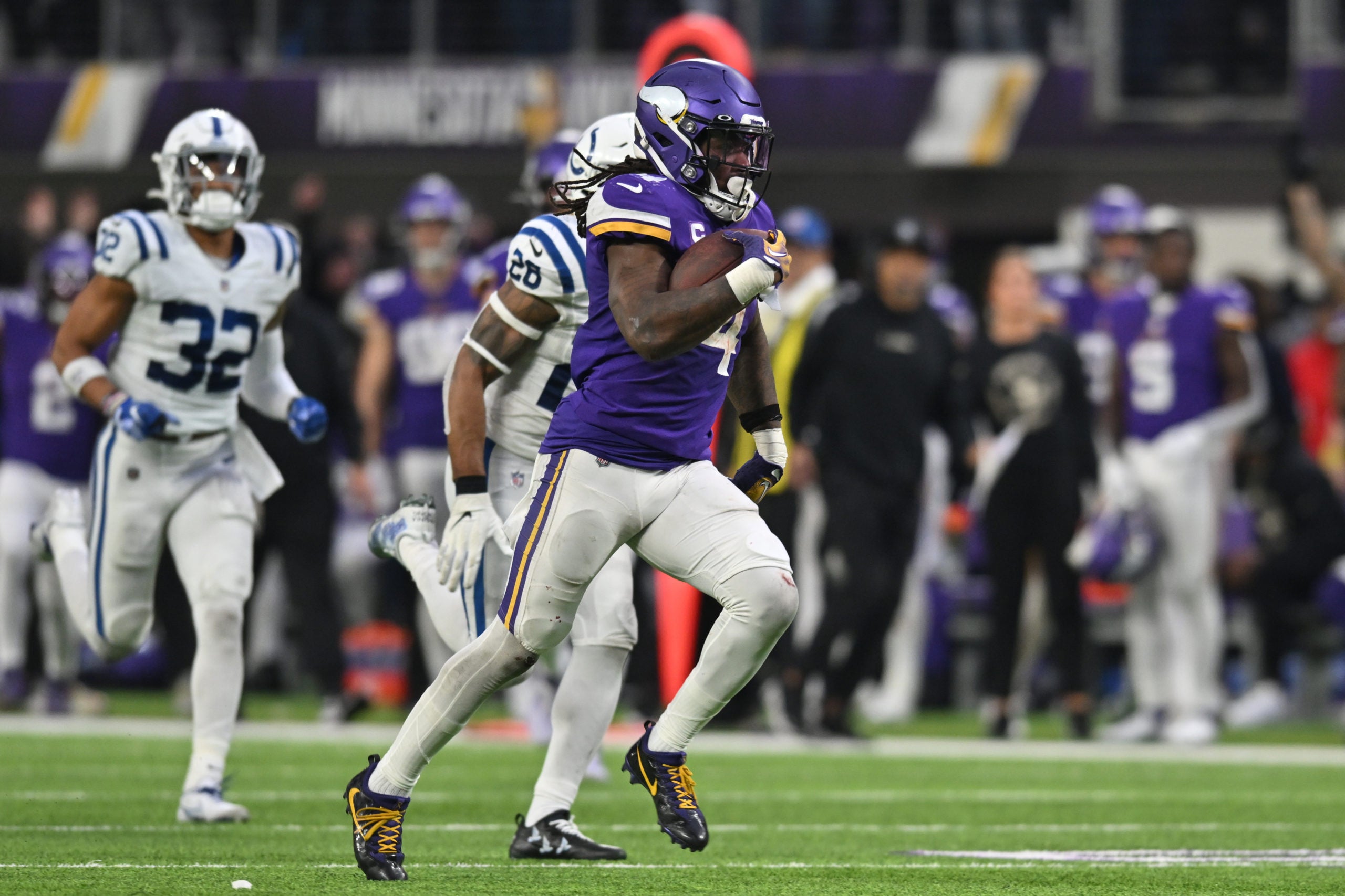 Dec 17, 2022; Minneapolis, Minnesota, USA; Minnesota Vikings running back Dalvin Cook (4) scores on a touchdown reception as Indianapolis Colts safety Rodney McLeod (26) and safety Julian Blackmon (32) pursue late during the fourth quarter at U.S. Bank Stadium. Mandatory Credit: Jeffrey Becker-USA TODAY Sports