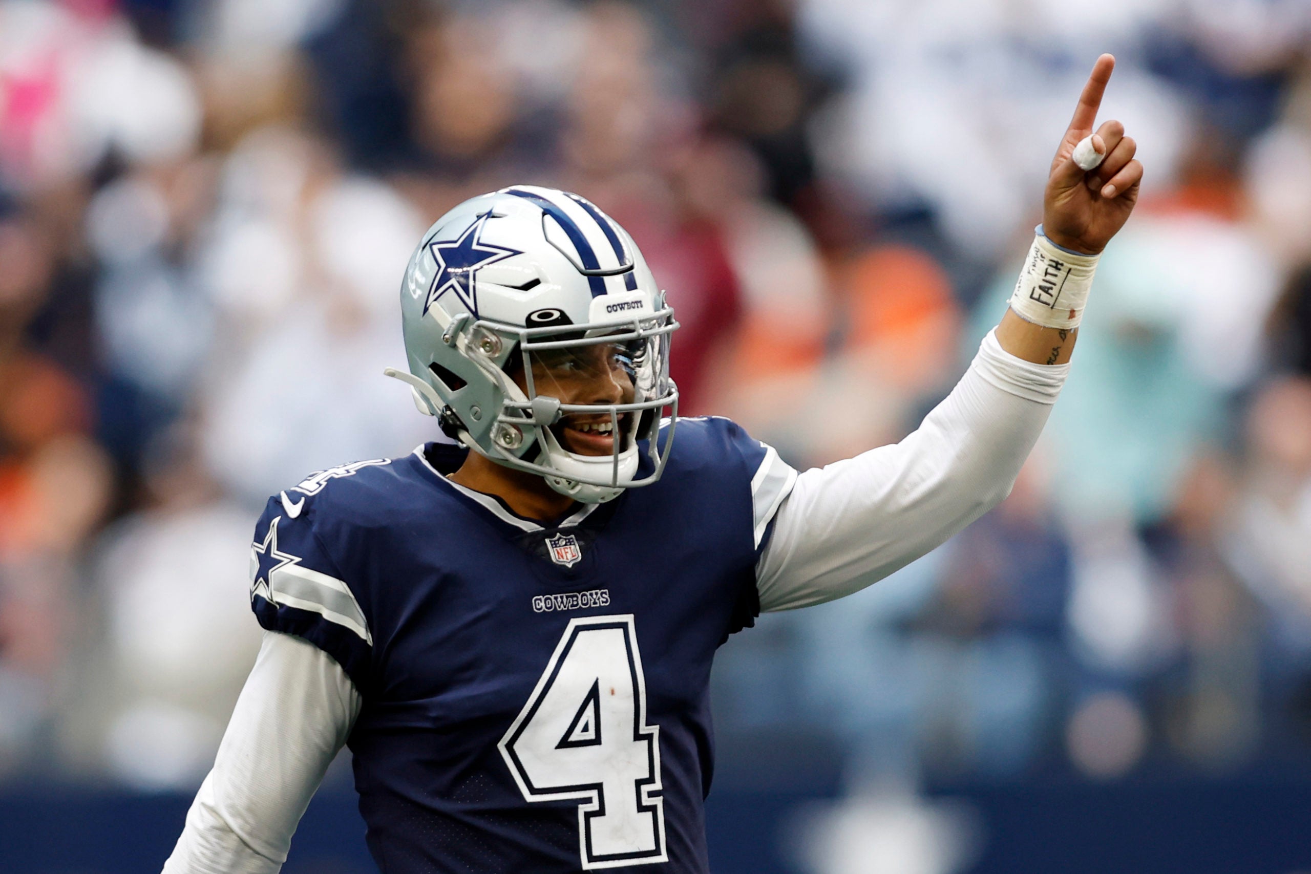 Oct 30, 2022; Arlington, Texas, USA; Dallas Cowboys quarterback Dak Prescott (4) celebrates a touchdown in the fourth quarter against the Chicago Bears at AT&T Stadium. Mandatory Credit: Tim Heitman-USA TODAY Sports