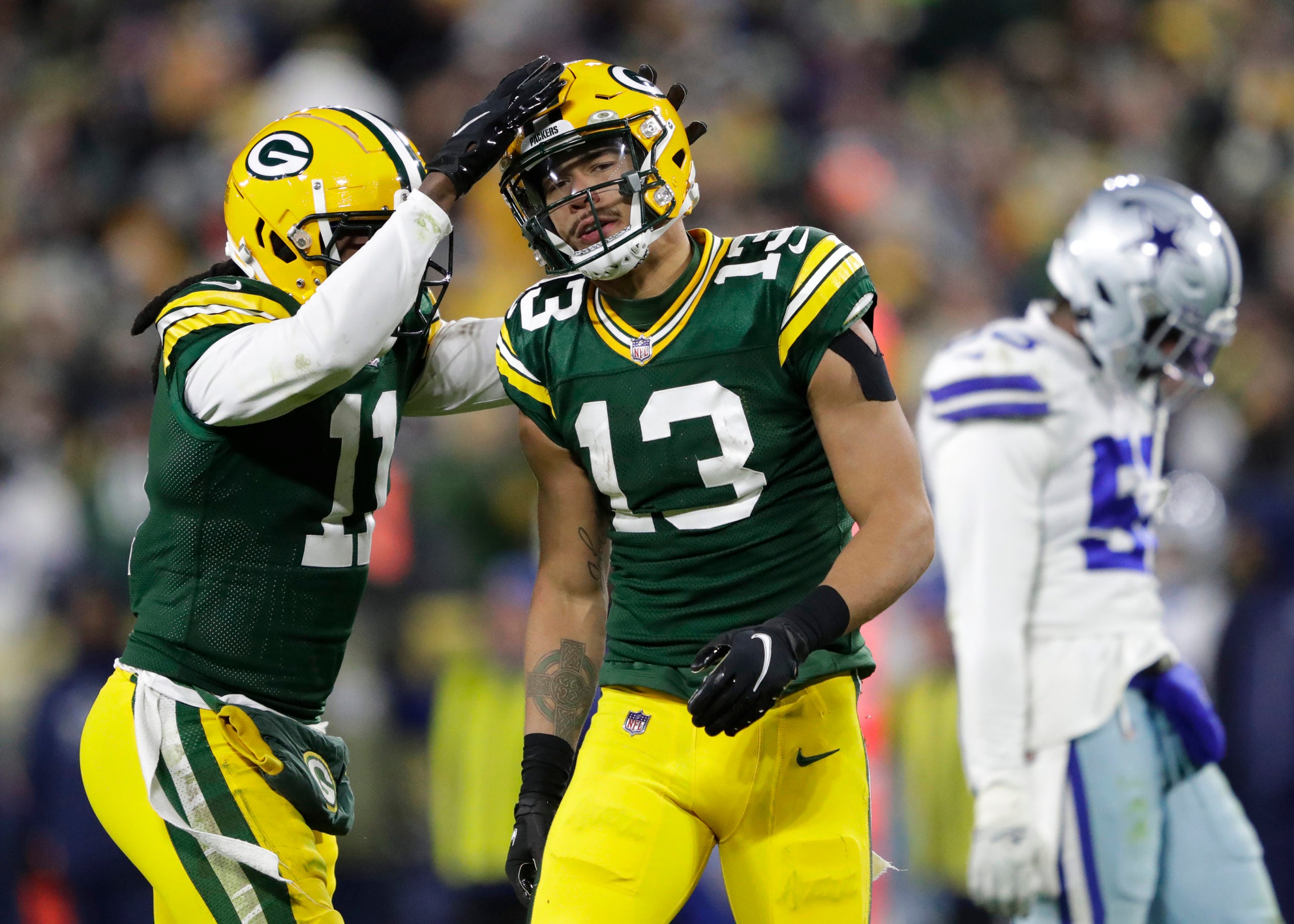 Nov 13, 2022; Green Bay, Wisconsin, USA; Green Bay Packers wide receiver Sammy Watkins (11) celebrates with wide receiver Allen Lazard (13) after Lazard got a first down reception in overtime against the Dallas Cowboys at Lambeau Field. Mandatory Credit: Dan Powers/USA TODAY NETWORK-Wisconsin