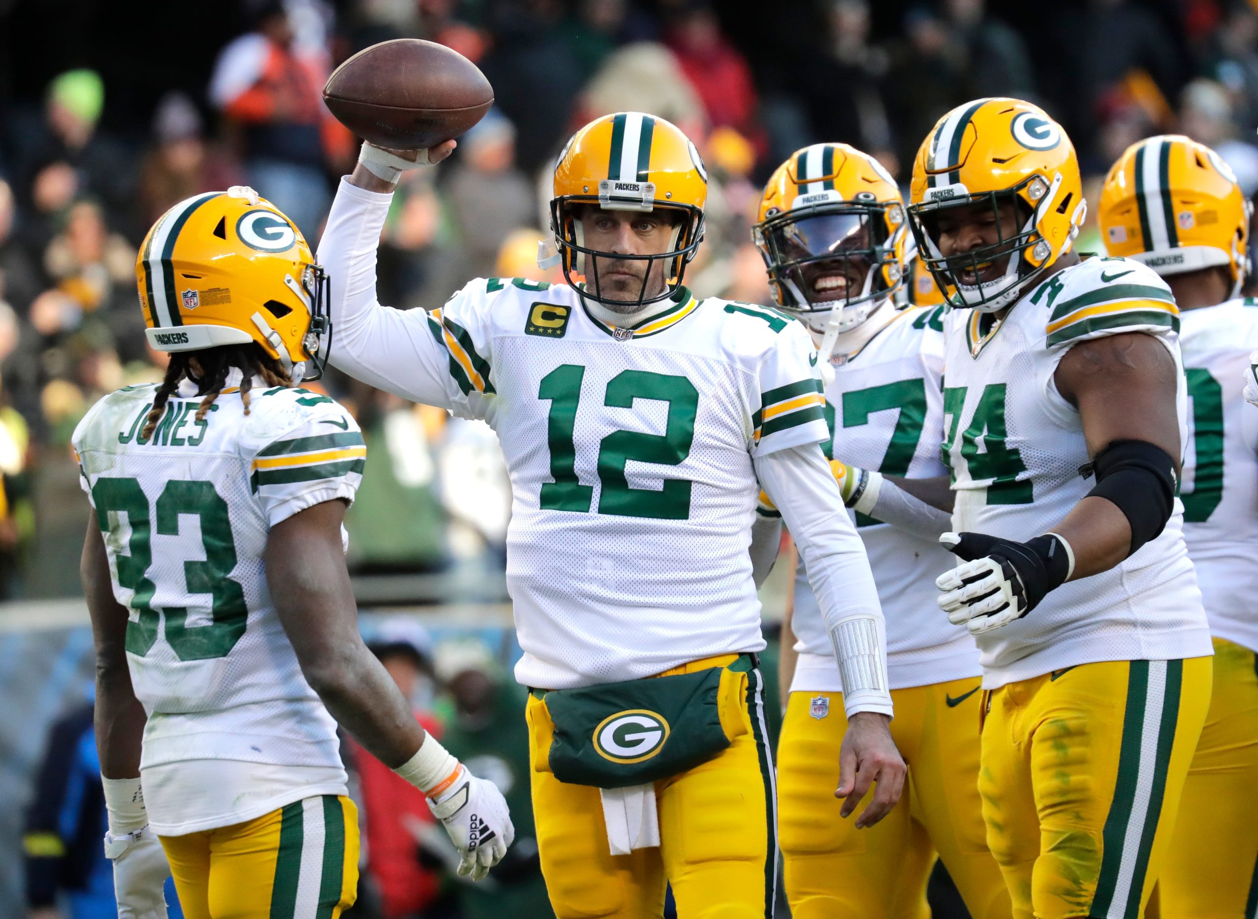 Green Bay Packers quarterback Aaron Rodgers (12) raises the ball in victory after taking a knee to end the game against the Chicago Bears during their football game Sunday, December 4, at Soldier Field in Chicago, Ill. Dan Powers/USA TODAY NETWORK-Wisconsin Apc Packvsbears 1204222056djp