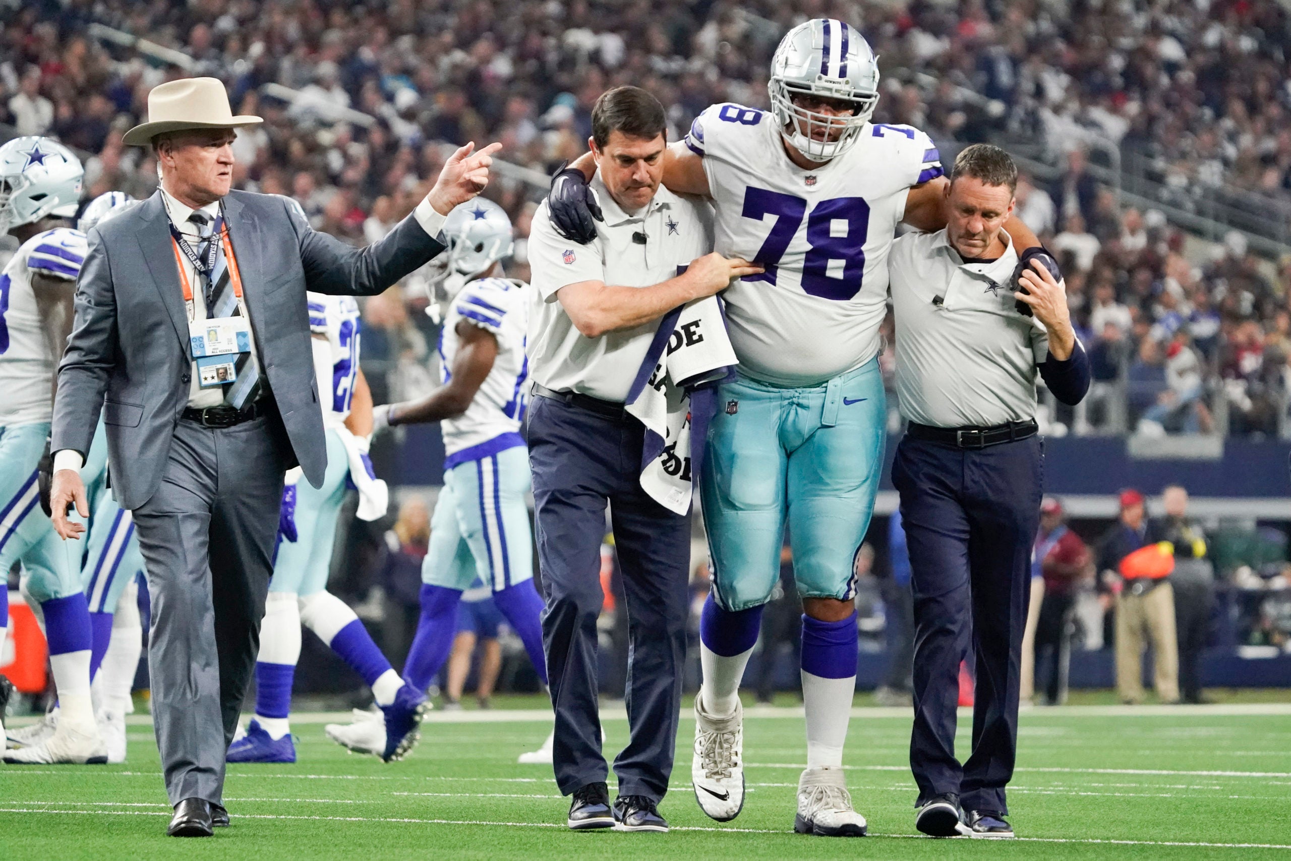 Dec 11, 2022; Arlington, Texas, USA; Dallas Cowboys offensive tackle Terence Steele (78) leaves the field with an apparent injury during the second quarter against the Houston Texans at AT&T Stadium. Mandatory Credit: Raymond Carlin III-USA TODAY Sports