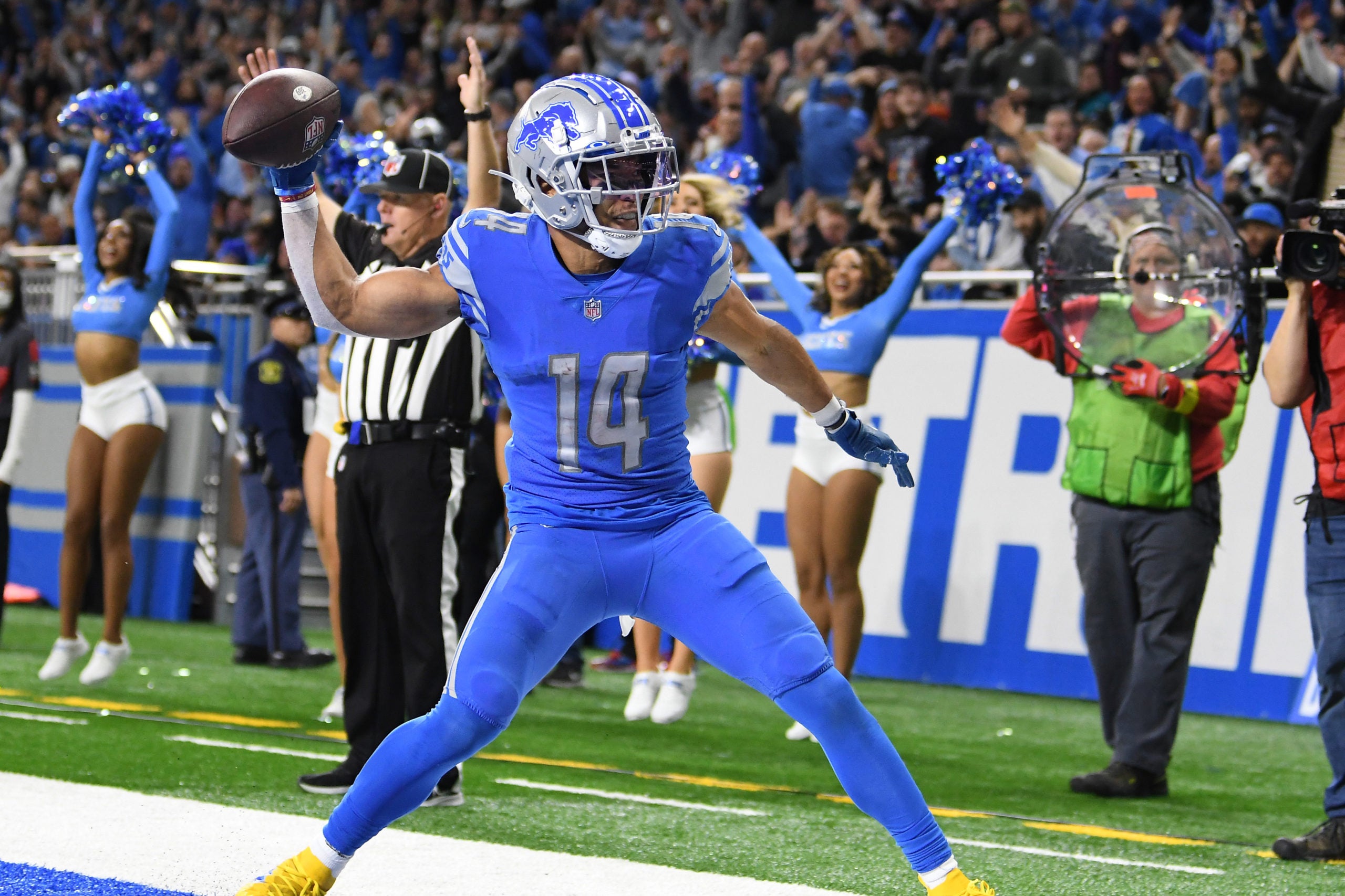 Dec 4, 2022; Detroit, Michigan, USA; Detroit Lions wide receiver Amon-Ra St. Brown (14) celebrates by throwing the football into the end zone wall after scoring a touchdown on a pass from quarterback Jared Goff (not pictured) against the Jacksonville Jaguars in the fourth quarter  at Ford Field. Mandatory Credit: Lon Horwedel-USA TODAY Sports