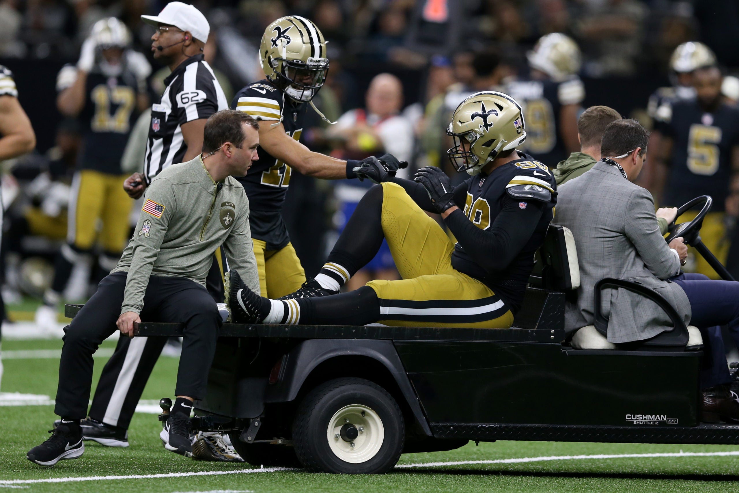 Nov 20, 2022; New Orleans, Louisiana, USA; New Orleans Saints defensive end Payton Turner (98) is carted off the field with an injury in the second quarter against the Los Angeles Rams at the Caesars Superdome. Mandatory Credit: Chuck Cook-USA TODAY Sports