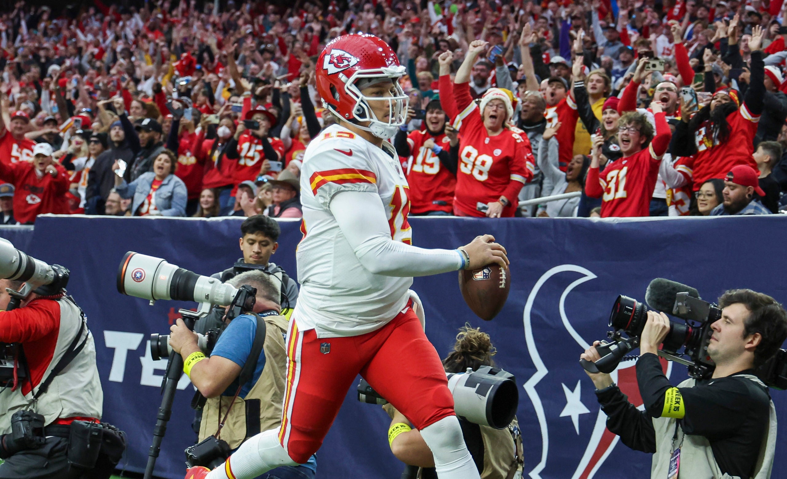 Dec 18, 2022; Houston, Texas, USA; Kansas City Chiefs quarterback Patrick Mahomes (15) runs out of the end zone after scoring a touchdown during the fourth quarter against the Houston Texans at NRG Stadium. Mandatory Credit: Troy Taormina-USA TODAY Sports