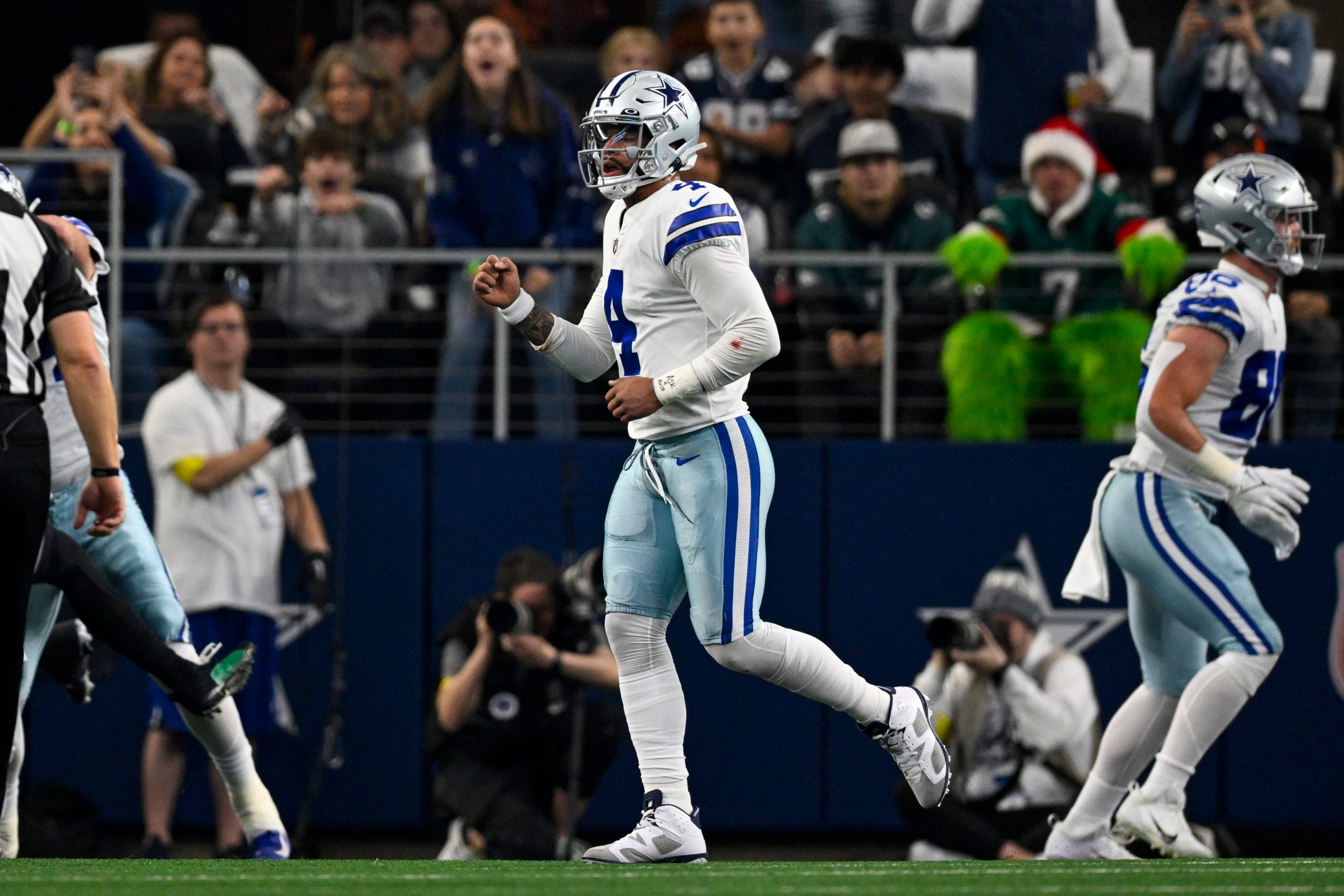 Dec 24, 2022; Arlington, Texas, USA; Dallas Cowboys quarterback Dak Prescott (4) celebrates a touchdown  against the Philadelphia Eagles during the first quarter at AT&T Stadium. Mandatory Credit: Jerome Miron-USA TODAY Sports