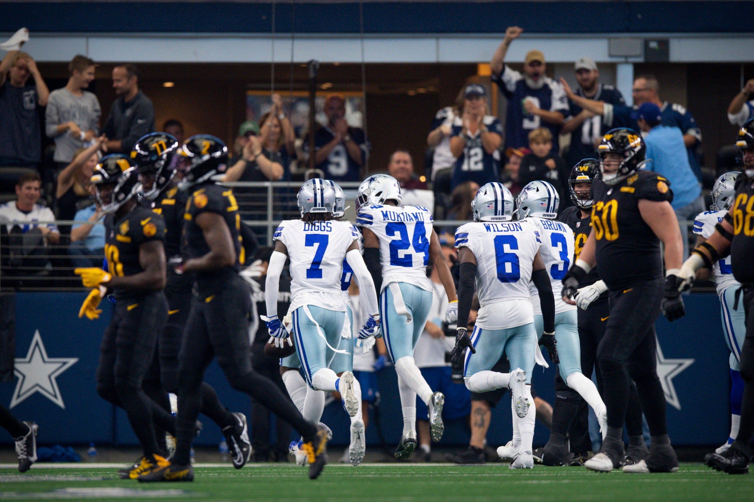 Oct 2, 2022; Arlington, Texas, USA; Dallas Cowboys cornerback Trevon Diggs (7) and safety Israel Mukuamu (24) and safety Donovan Wilson (6) and cornerback Anthony Brown (3) celebrate an interception by cornerback DaRon Bland (26) against the Washington Commanders during the second half at AT&T Stadium. Mandatory Credit: Jerome Miron-USA TODAY Sports