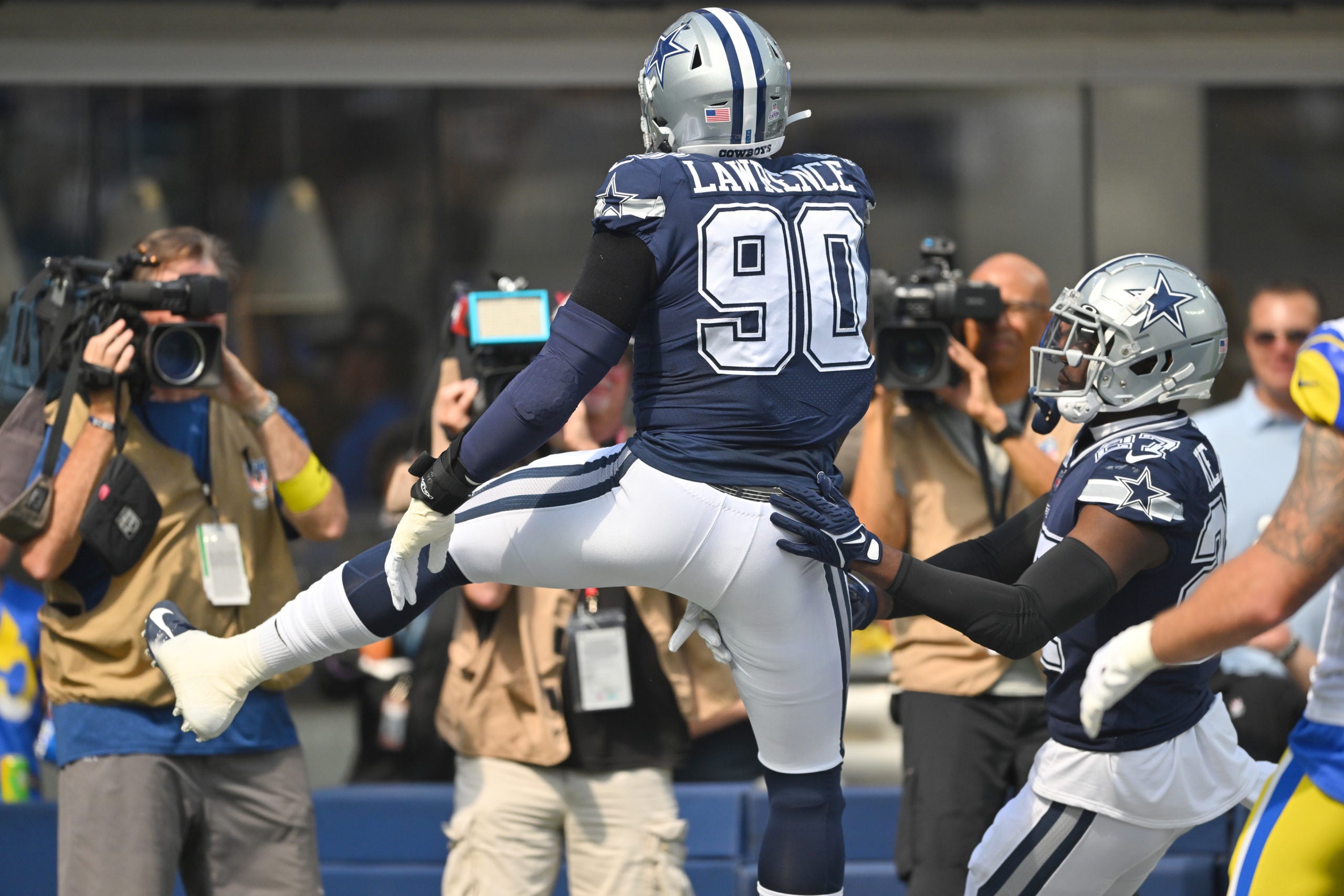 Oct 9, 2022; Inglewood, California, USA; Dallas Cowboys defensive end DeMarcus Lawrence (90) celebrates after scoring a touchdown after recovering a fumble in the first quarter against the Los Angeles Rams the game at SoFi Stadium. Mandatory Credit: Jayne Kamin-Oncea-USA TODAY Sports