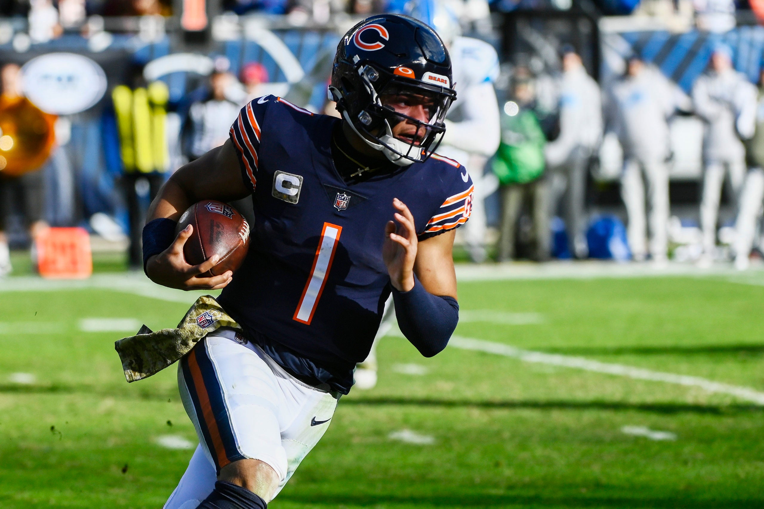 Nov 13, 2022; Chicago, Illinois, USA;  Chicago Bears quarterback Justin Fields (1) runs with the ball against the Detroit Lions during the second half at Soldier Field. Mandatory Credit: Matt Marton-USA TODAY Sports