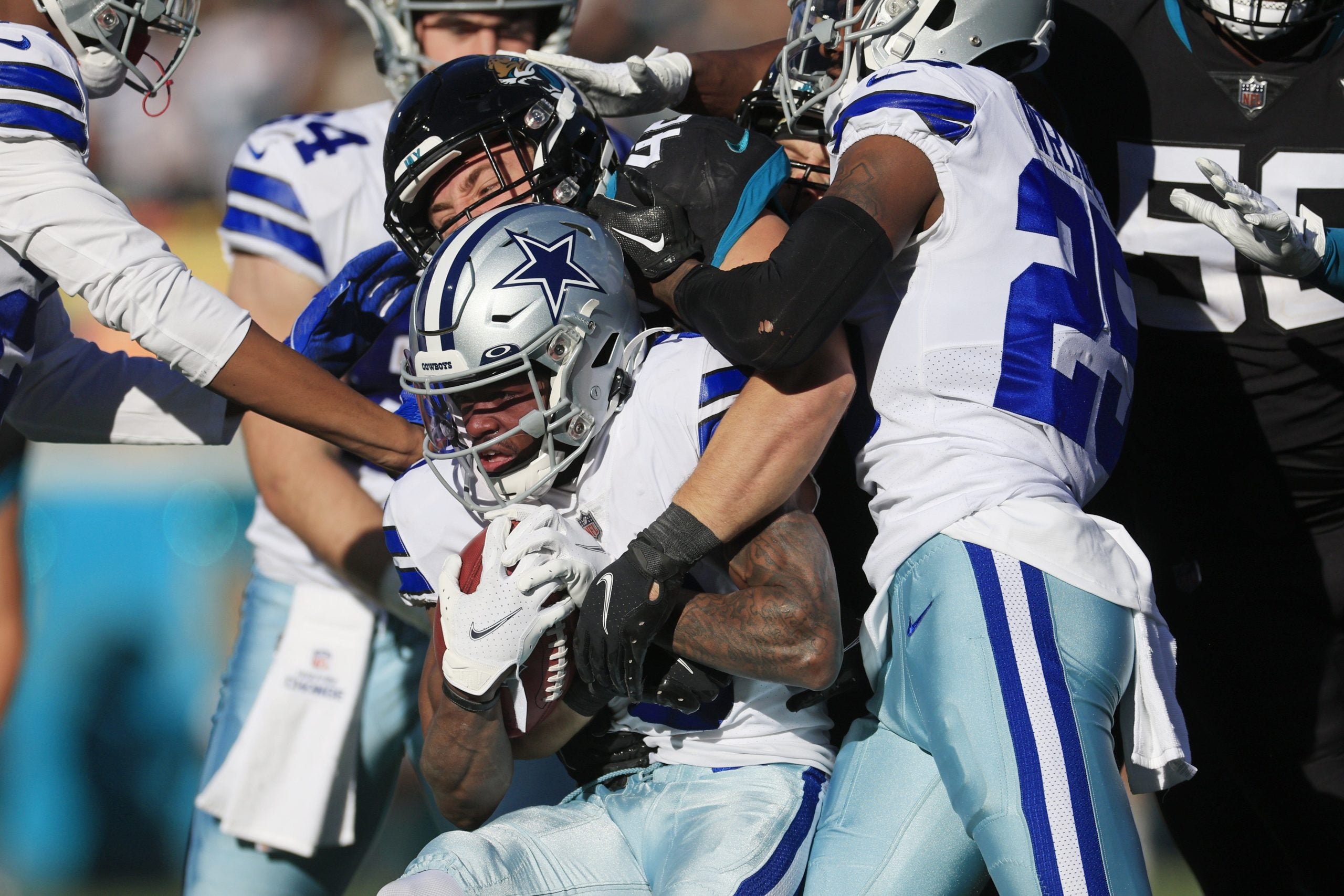 Dallas Cowboys wide receiver KaVontae Turpin (9) is stopped by Jacksonville Jaguars linebacker Chad Muma (48) during the third quarter of a regular season NFL football matchup Sunday, Dec. 18, 2022 at TIAA Bank Field in Jacksonville. The Jacksonville Jaguars edged the Dallas Cowboys 40-34 in overtime. [Corey Perrine/Florida Times-Union] Jki 121822 Cowboys Jags Cp 54