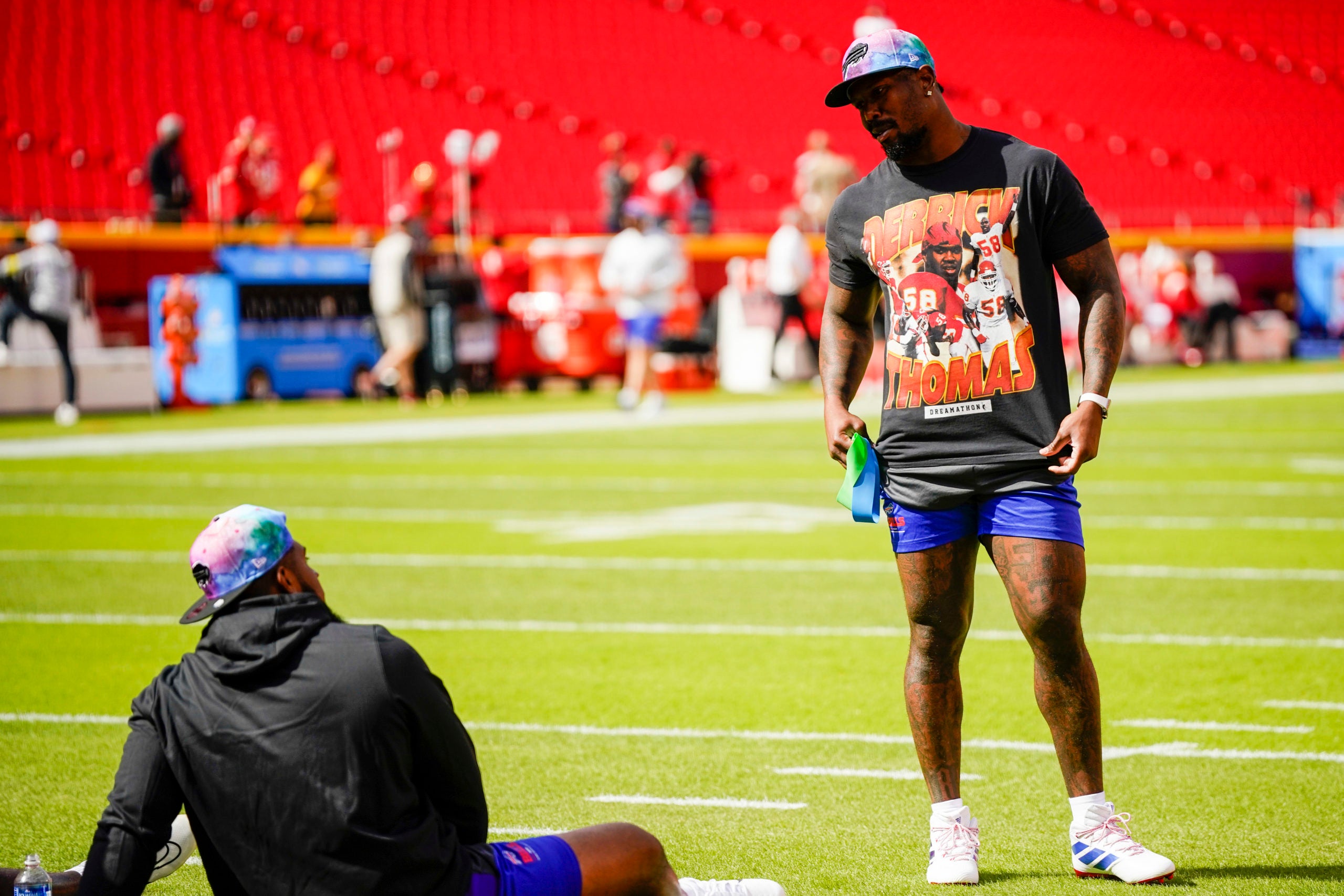 Oct 16, 2022; Kansas City, Missouri, USA; Buffalo Bills linebacker Von Miller (40) shows his shirt featuring former Kansas City Chiefs linebacker Derrick Thomas to teammates prior to a game at GEHA Field at Arrowhead Stadium. Mandatory Credit: Jay Biggerstaff-USA TODAY Sports
