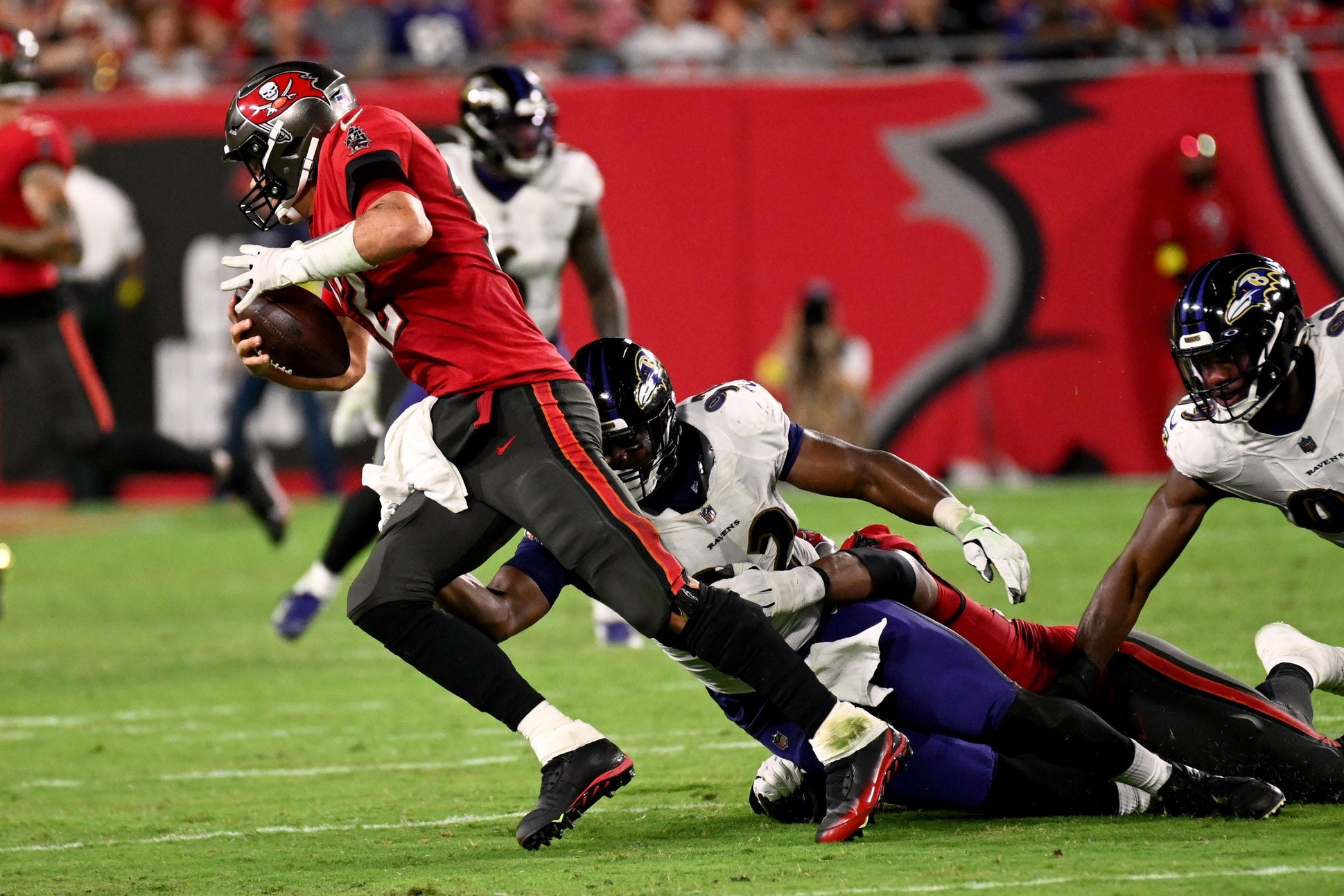 Oct 27, 2022; Tampa, Florida, USA; Tampa Bay Buccaneers quarterback Tom Brady (12) gets sacked by Baltimore Ravens defensive lineman Justin Madubuike (92) in the second half at Raymond James Stadium. Mandatory Credit: Jonathan Dyer-USA TODAY Sports
