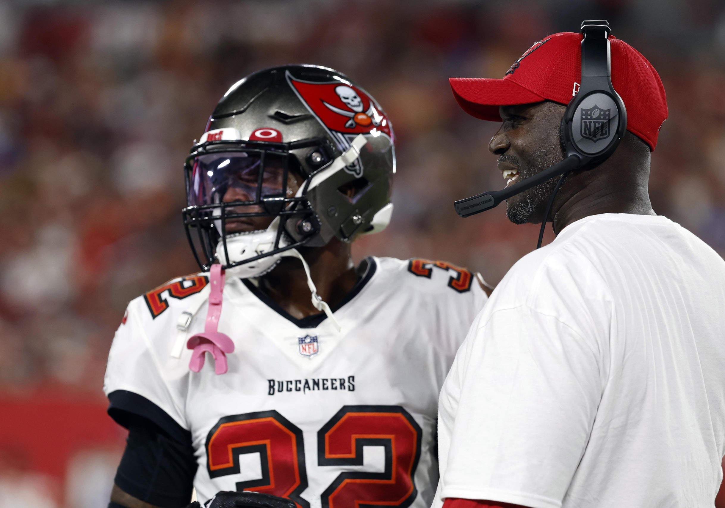 Oct 2, 2022; Tampa, Florida, USA; Tampa Bay Buccaneers head coach Todd Bowles talks with safety Mike Edwards (32) against the Kansas City Chiefs during the first half at Raymond James Stadium. Mandatory Credit: Kim Klement-USA TODAY Sports