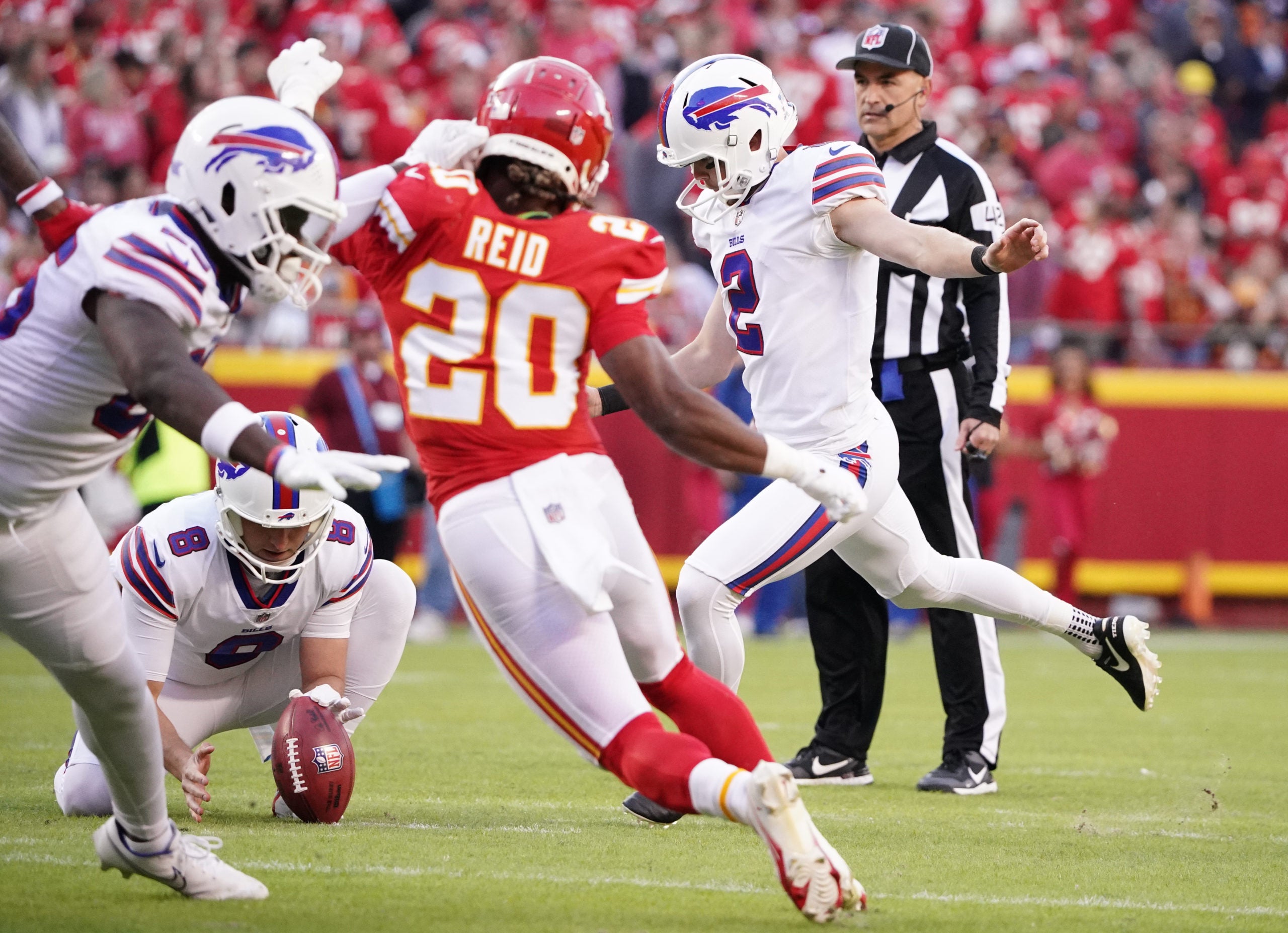 Oct 16, 2022; Kansas City, Missouri, USA; Buffalo Bills place kicker Tyler Bass (2) kicks the point after touchdown against the Kansas City Chiefs during the second half at GEHA Field at Arrowhead Stadium. Mandatory Credit: Denny Medley-USA TODAY Sports