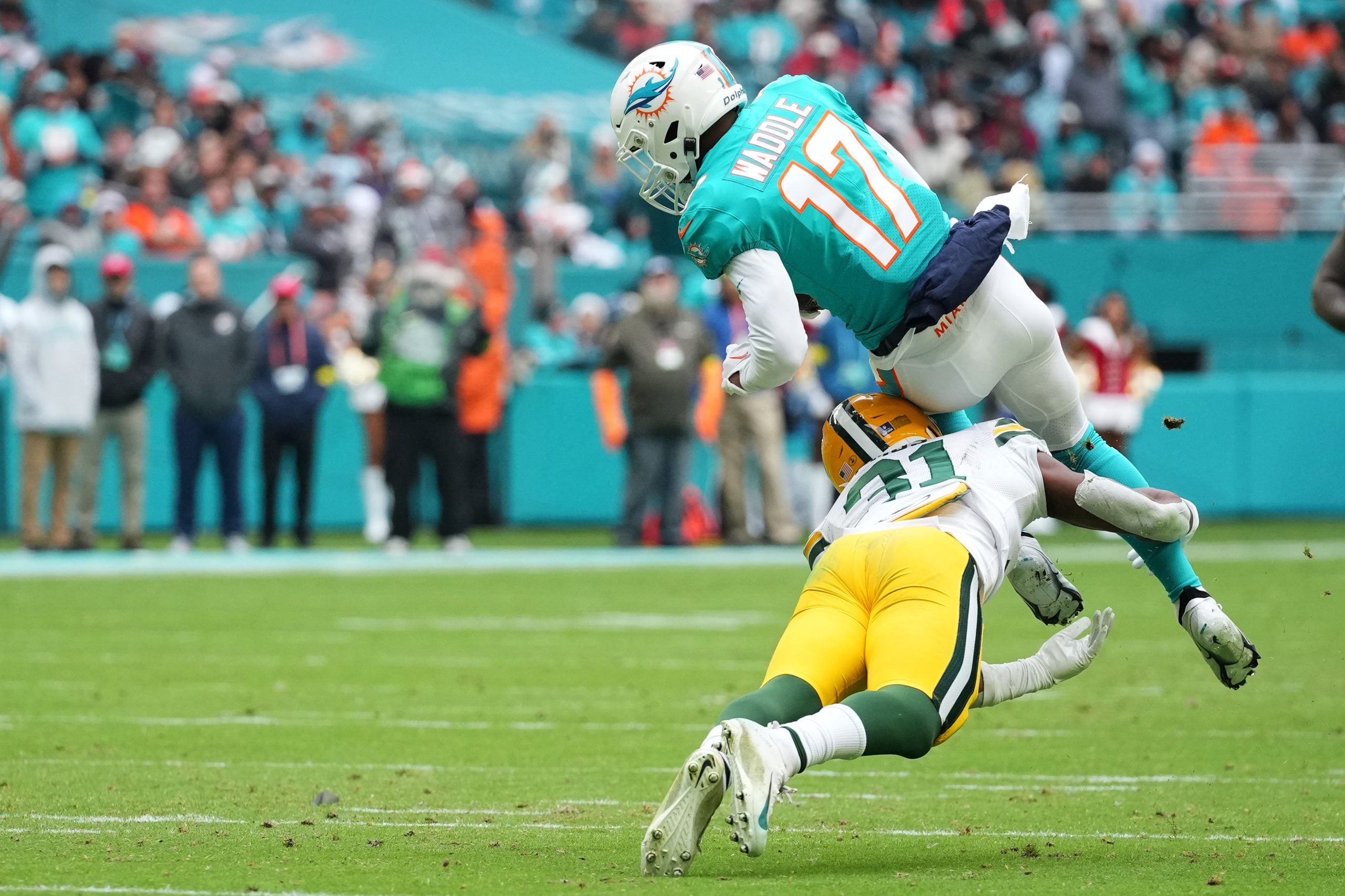 Dec 25, 2022; Miami Gardens, Florida, USA; Green Bay Packers safety Adrian Amos (31) tackles Miami Dolphins wide receiver Jaylen Waddle (17) during the first half at Hard Rock Stadium. Mandatory Credit: Jasen Vinlove-USA TODAY Sports