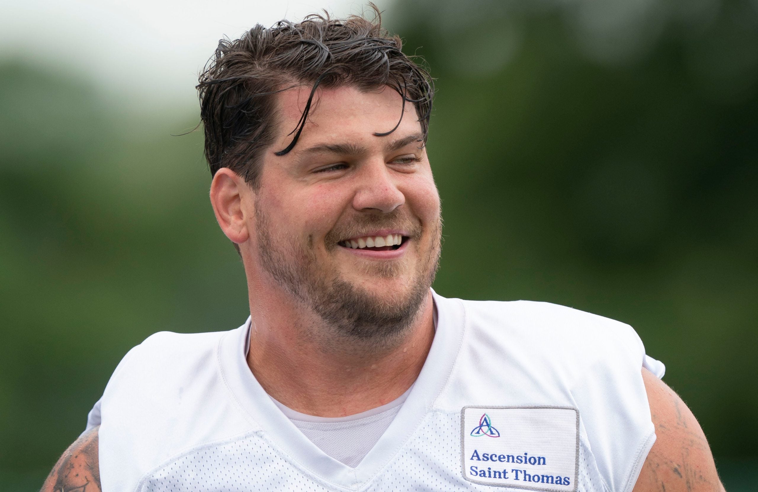 Tennessee Titans offensive tackle Taylor Lewan (77) laughs with teammates during a training camp practice at Saint Thomas Sports Park Thursday, July 28, 2022, in Nashville, Tenn. Nas 0728 Titans 012