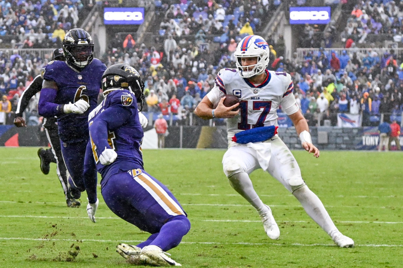 Oct 2, 2022; Baltimore, Maryland, USA;  Buffalo Bills quarterback Josh Allen (17) runs as Baltimore Ravens cornerback Marlon Humphrey (44) defends during the third quarter at M&T Bank Stadium. Mandatory Credit: Tommy Gilligan-USA TODAY Sports