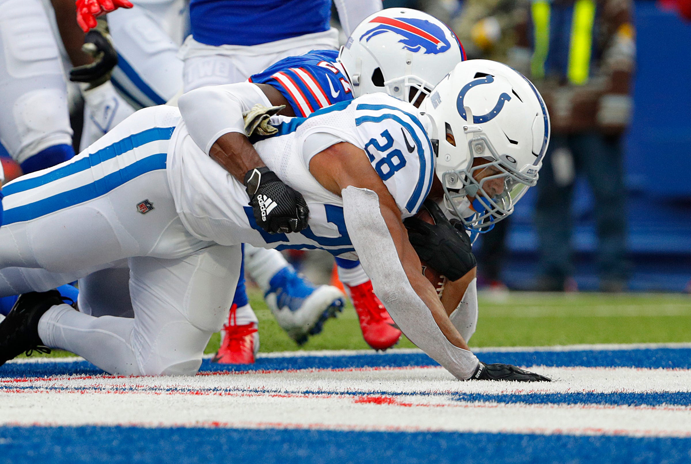 Buffalo Bills cornerback Tre'Davious White (27) tackles Indianapolis Colts running back Jonathan Taylor (28) as he lands in the end zone in the first quarter for the team's first touchdown of the game Sunday, Nov. 21, 2021, at Highmark Stadium in Orchard Park, N.Y. Indianapolis Colts At Buffalo Bills Nfl On Sunday Nov 21 2021 At Highmark Stadium In Orchard Park N Y