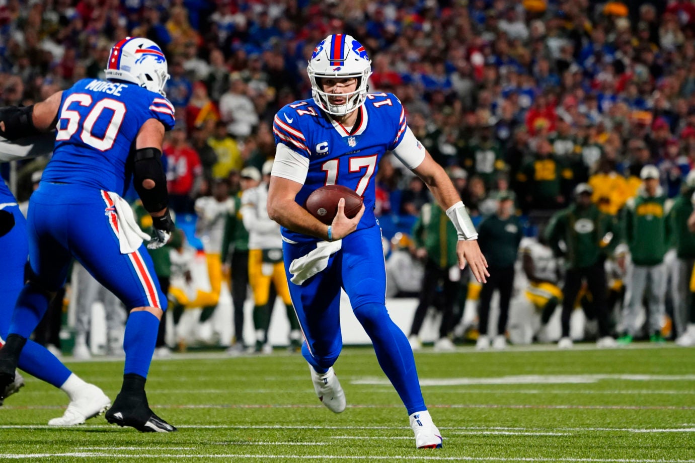 Oct 30, 2022; Orchard Park, New York, USA; Buffalo Bills quarterback Josh Allen (17) runs with the ball against the Green Bay Packers during the first half at Highmark Stadium. Mandatory Credit: Gregory Fisher-USA TODAY Sports