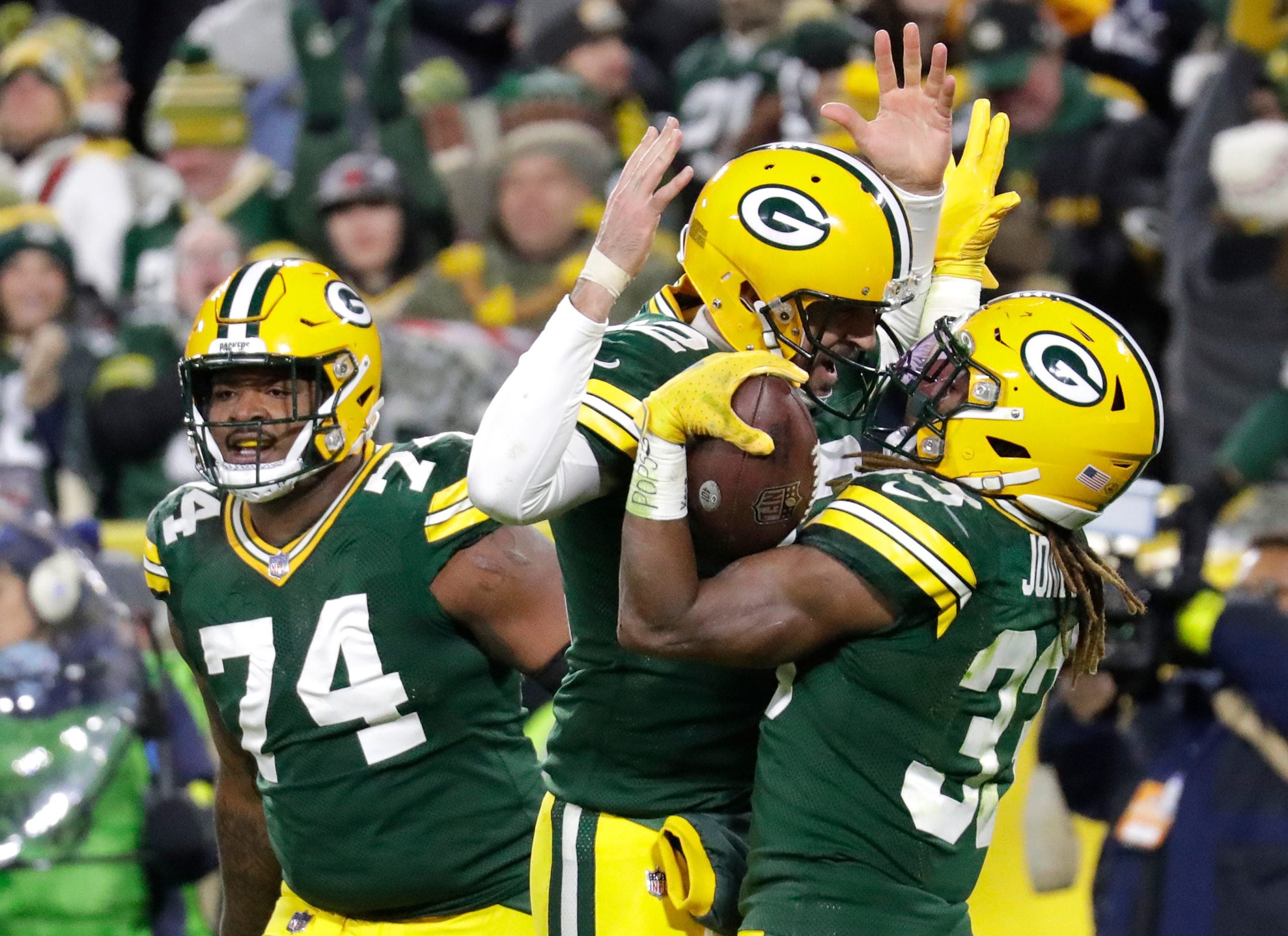 Green Bay Packers quarterback Aaron Rodgers (12) celebrates with Aaron Jones (33) after he scored a touchdown against the Dallas Cowboys during their football game Sunday, November 13, at Lambeau Field in Green Bay, Wis. Dan Powers/USA TODAY NETWORK-Wisconsin Apc Packvscowboys 1113221183djpa