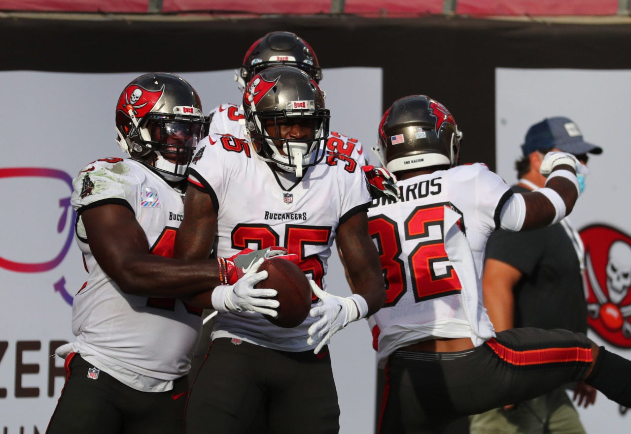 Oct 18, 2020; Tampa, Florida, USA; Tampa Bay Buccaneers cornerback Jamel Dean (35) returns an interception for a touchdown and celebrates with teammates against the Green Bay Packers during the second quarter of a NFL game at Raymond James Stadium. Mandatory Credit: Kim Klement-USA TODAY Sports