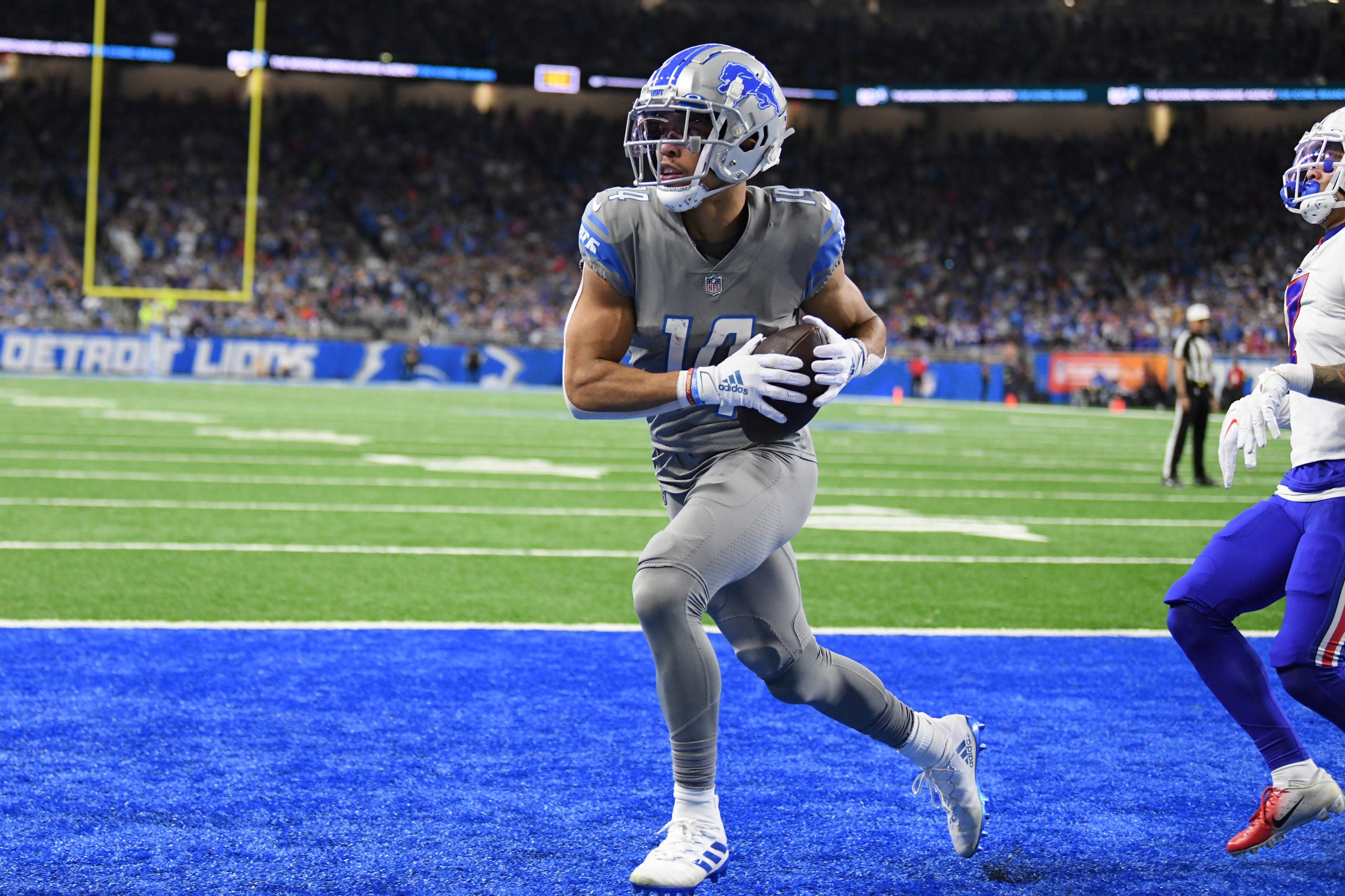 Nov 24, 2022; Detroit, Michigan, USA; Detroit Lions wide receiver Amon-Ra St. Brown catches a touchdown pass against the Buffalo Bills in the second quarter at Ford Field. Mandatory Credit: Lon Horwedel-USA TODAY Sports
