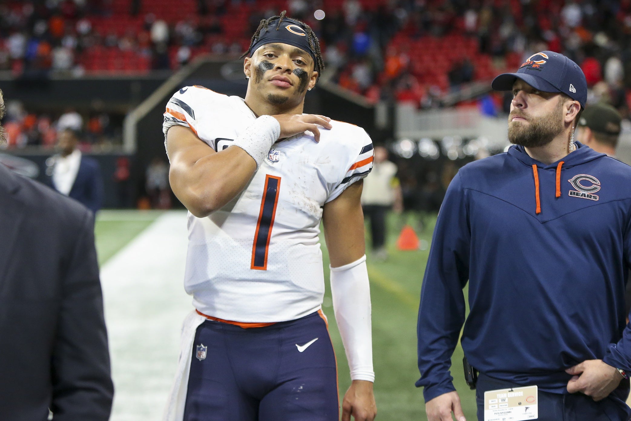 Nov 20, 2022; Atlanta, Georgia, USA; Chicago Bears quarterback Justin Fields (1) walks off the field with medical personnel after a game against the Atlanta Falcons at Mercedes-Benz Stadium. Mandatory Credit: Brett Davis-USA TODAY Sports