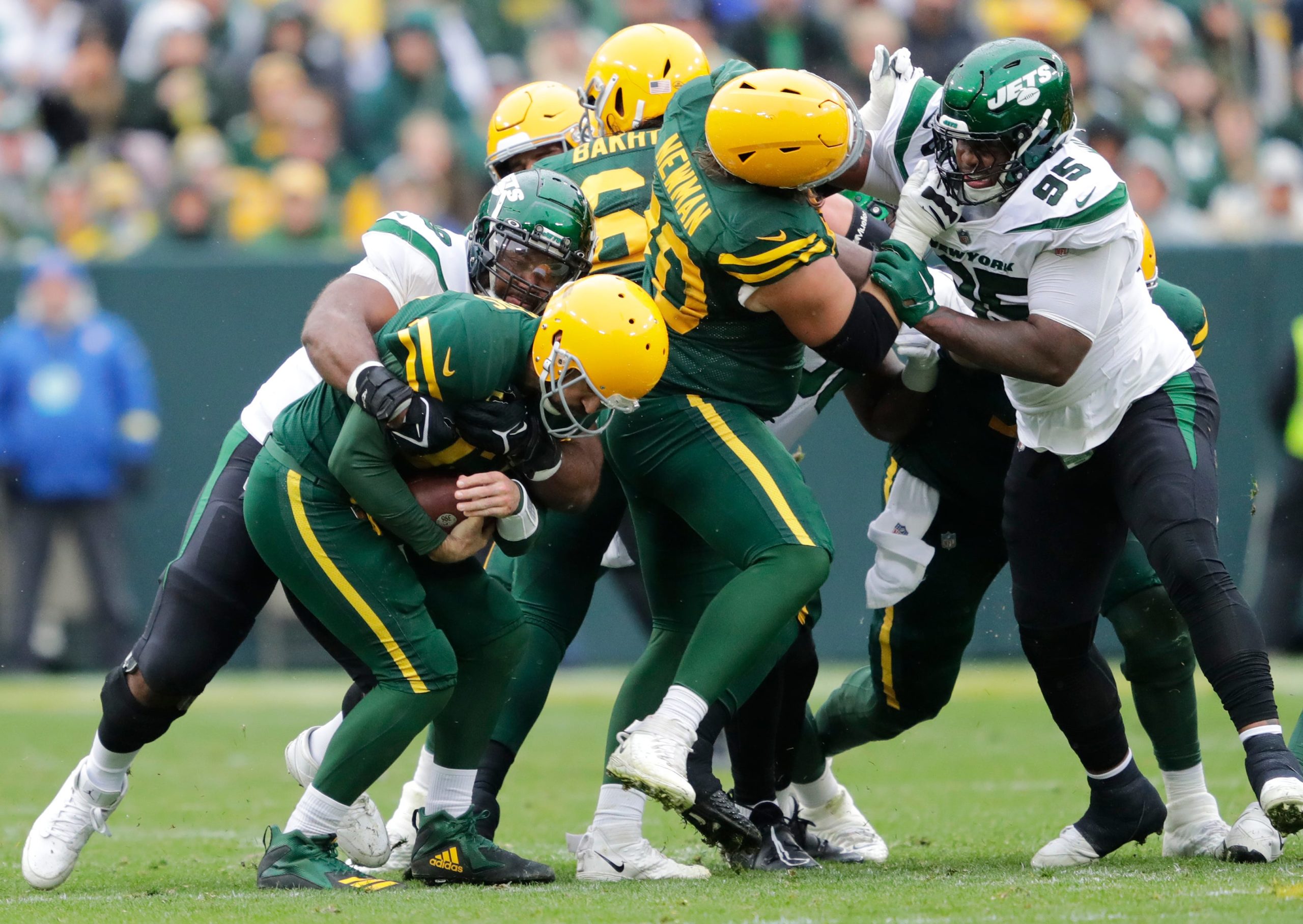 Green Bay Packers quarterback Aaron Rodgers (12) is sacked by New York Jets defensive tackle Sheldon Rankins (98)  on Sunday, Oct. 16, at Lambeau Field in Green Bay. Mjs Apc Packvsjets 1016220715djp