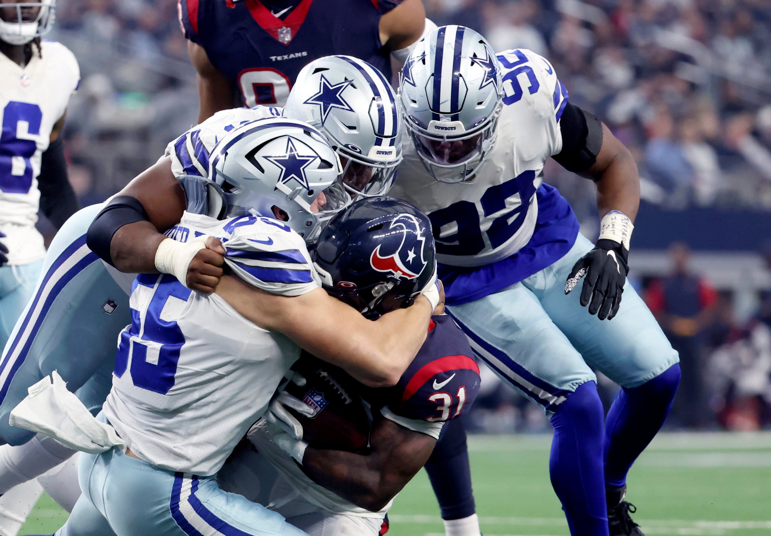 Dec 11, 2022; Arlington, Texas, USA;  Dallas Cowboys linebacker Leighton Vander Esch (55) tackles Houston Texans running back Dameon Pierce (31) during the second half at AT&T Stadium. Mandatory Credit: Kevin Jairaj-USA TODAY Sports