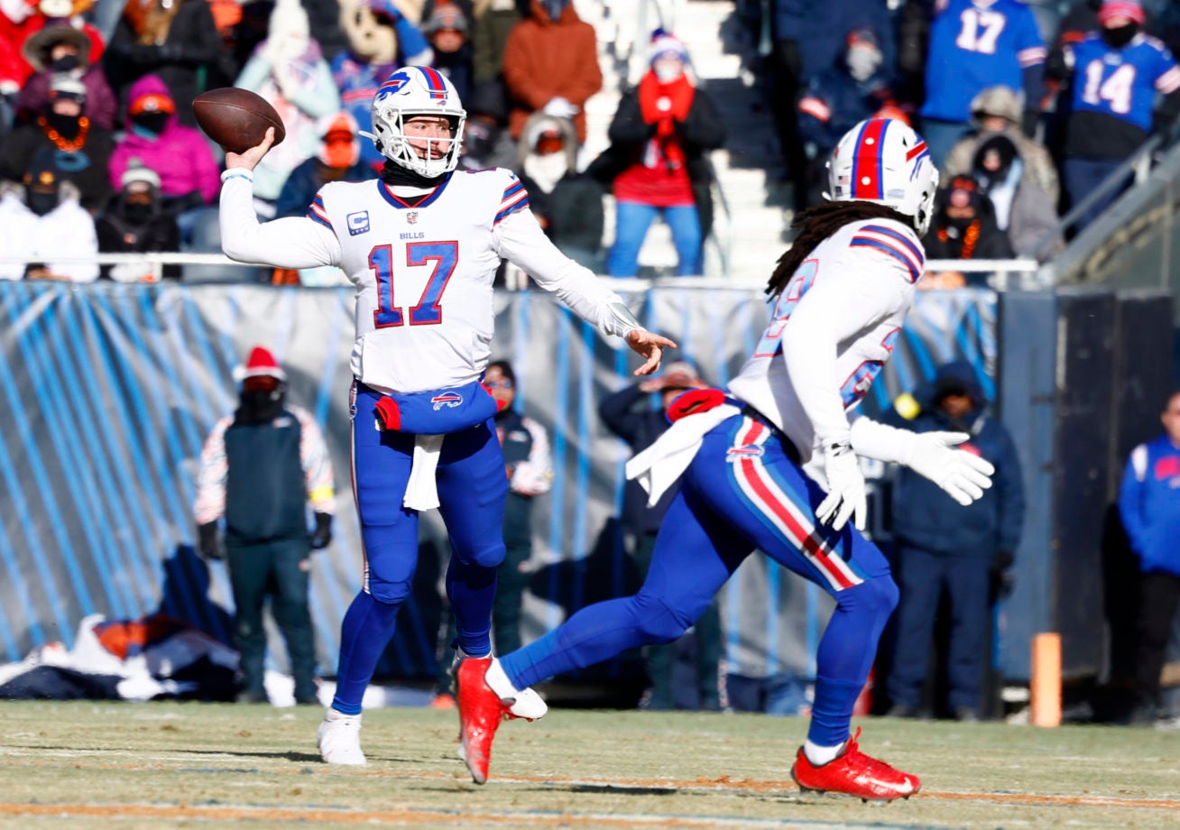 Dec 24, 2022; Chicago, Illinois, USA; Buffalo Bills quarterback Josh Allen (17) drops back to pass against the Chicago Bears  during the first quarter at Soldier Field. Mandatory Credit: Mike Dinovo-USA TODAY Sports
