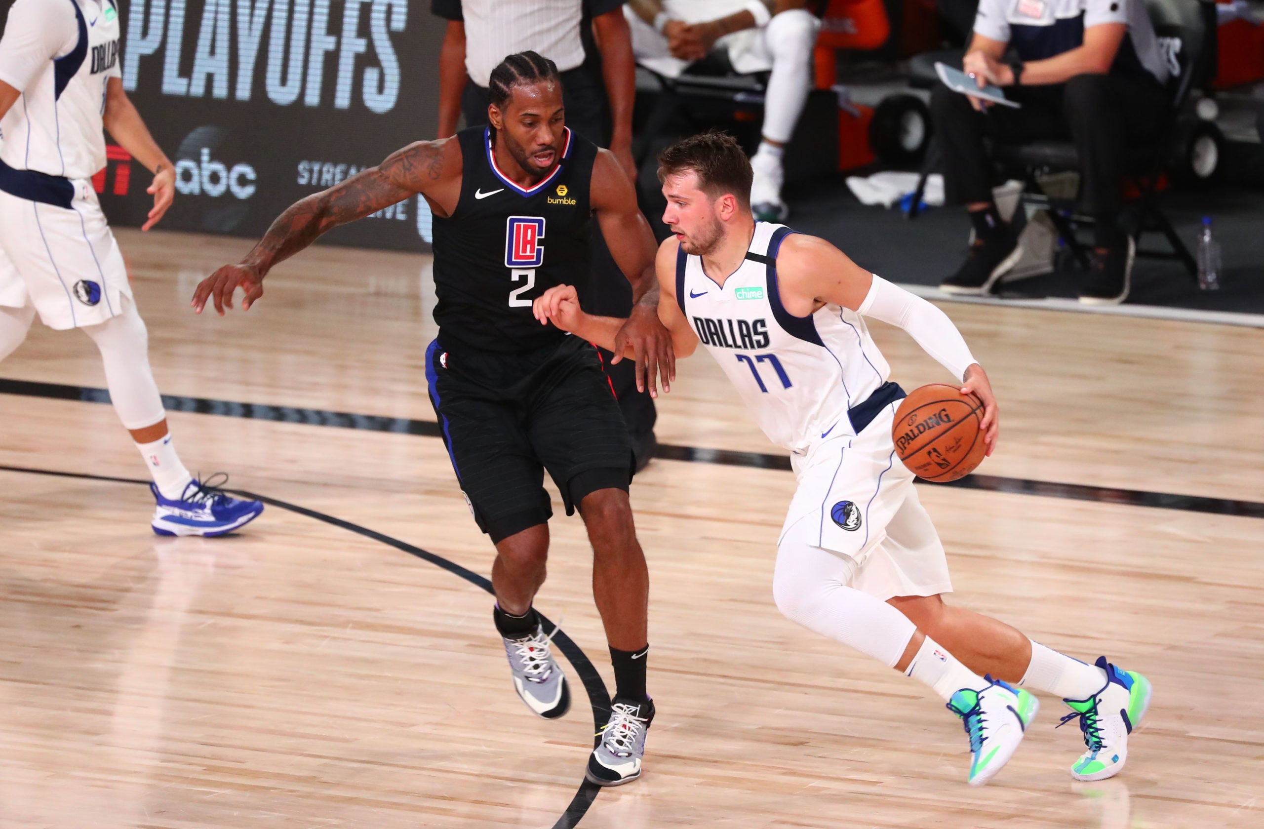 Aug 30, 2020; Lake Buena Vista, Florida, USA; Dallas Mavericks guard Luka Doncic (77) is defended by LA Clippers forward Kawhi Leonard (2) during the second quarter in game six of the first round of the 2020 NBA Playoffs at AdventHealth Arena. Mandatory Credit: Kim Klement-USA TODAY Sports