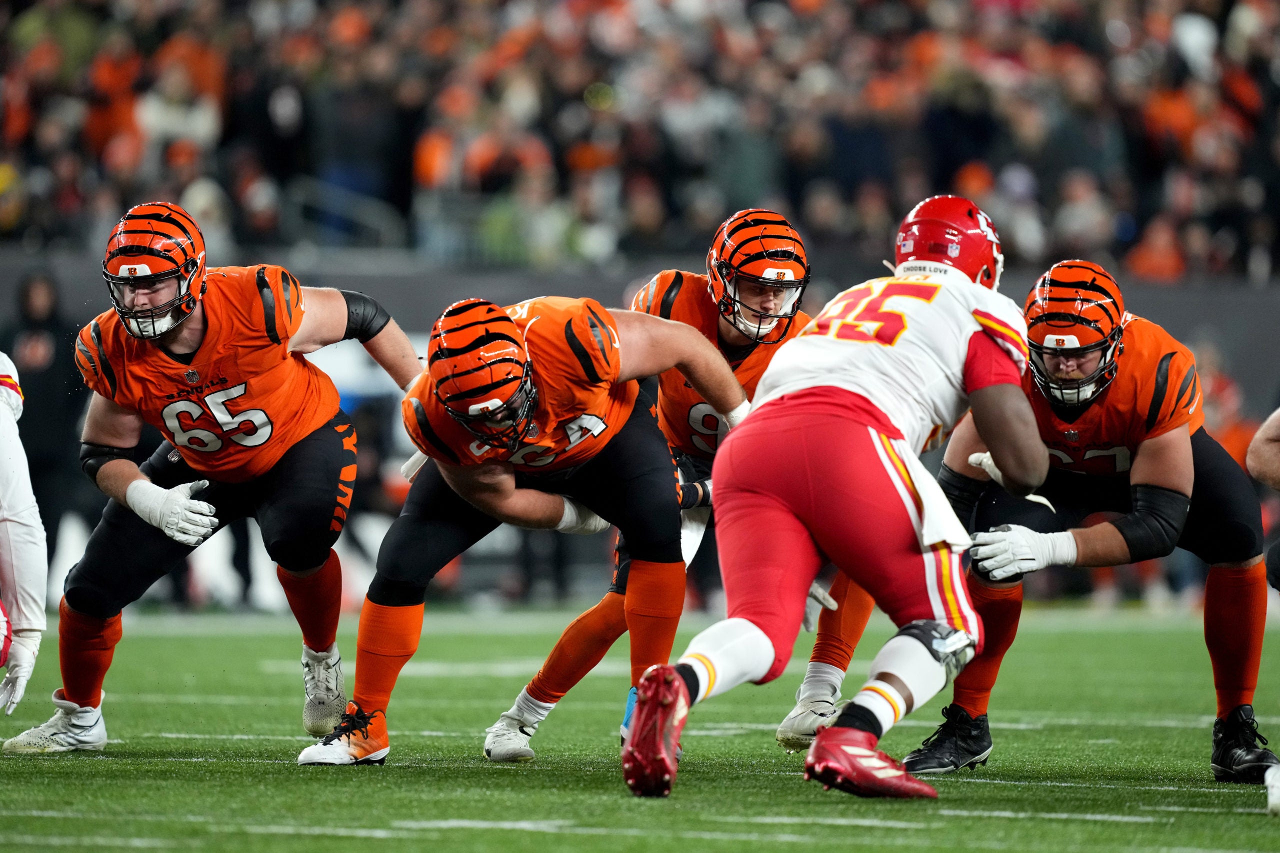 Dec 4, 2022; Cincinnati, Ohio, USA; Cincinnati Bengals quarterback Joe Burrow (9) takes a snap from Cincinnati Bengals center Ted Karras (64) in the third quarter of a Week 13 NFL game against the Kansas City Chiefs at Paycor Stadium. Mandatory Credit: Kareem Elgazzar-USA TODAY Sports