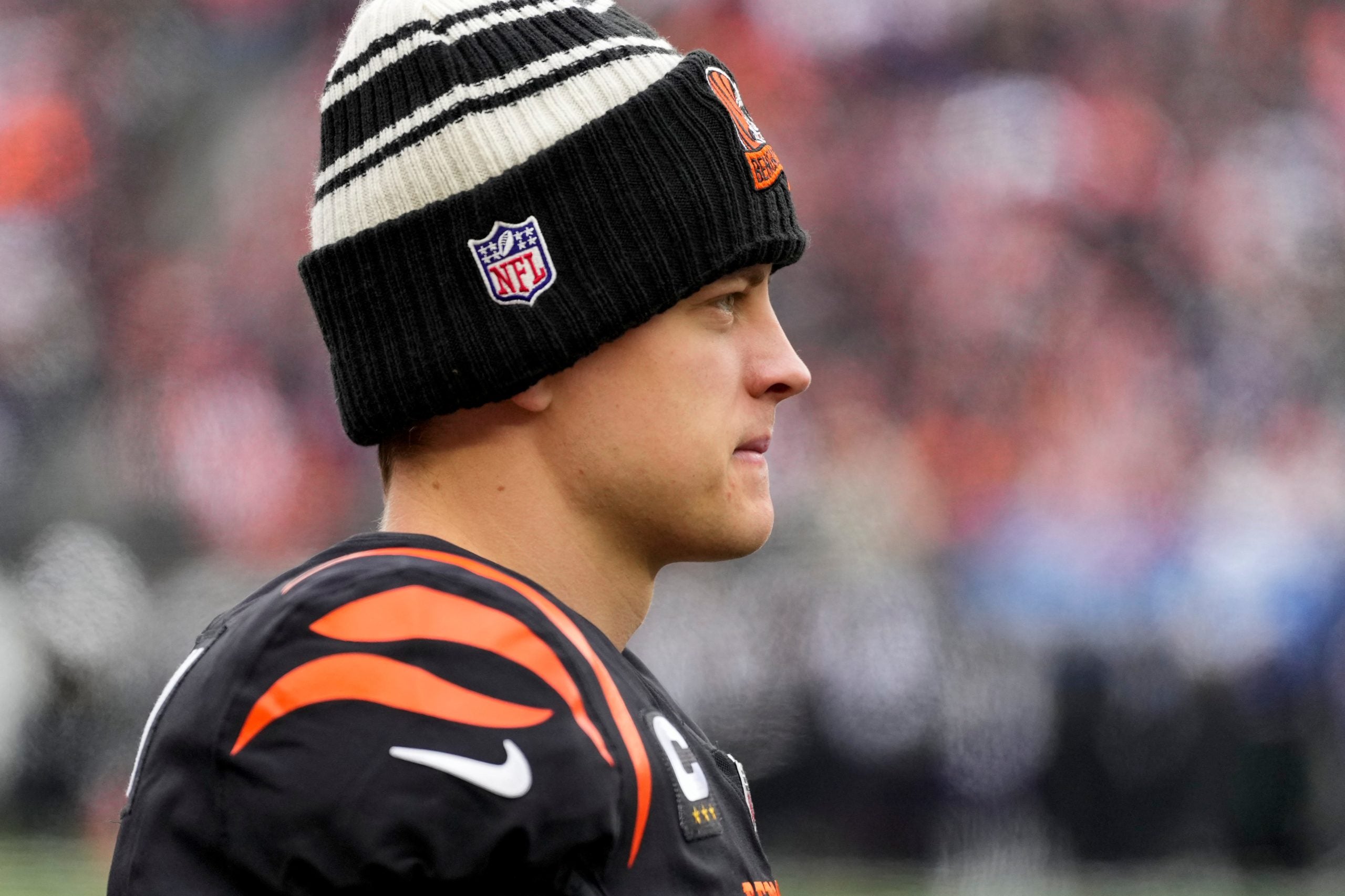 Cincinnati Bengals quarterback Joe Burrow (9) looks on from the sideline between drives in the second quarter of the NFL Week 18 game between the Cincinnati Bengals and the Baltimore Ravens at Paycor Stadium in downtown Cincinnati on Sunday, Jan. 8, 2023. The Bengals led 24-7 at halftime. Baltimore Ravens At Cincinnati Bengals Nfl Week 18