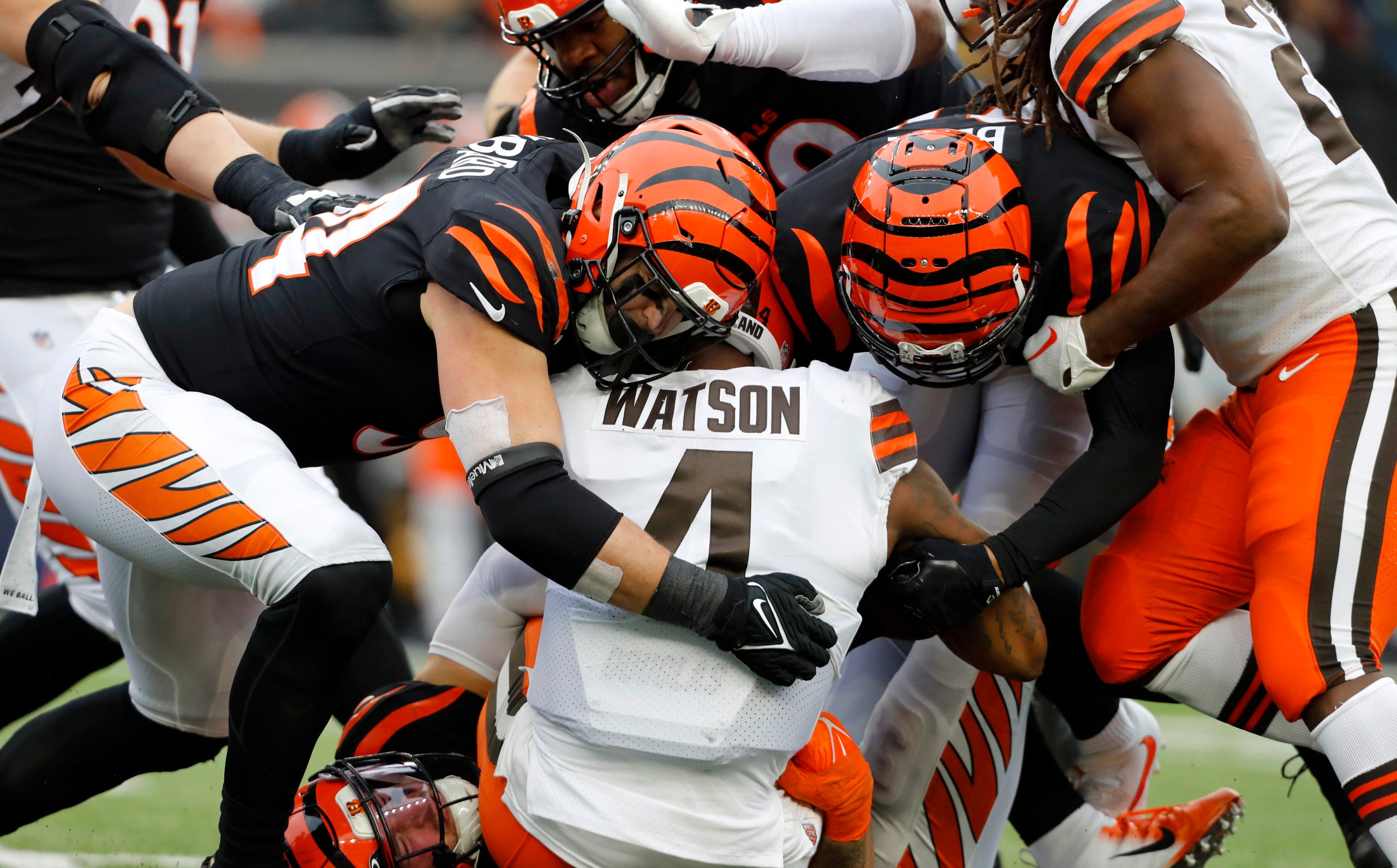 Dec 11, 2022; Cincinnati, Ohio, USA; Cincinnati Bengals defensive end Sam Hubbard (94) sacks Cleveland Browns quarterback Deshaun Watson (4) during the third quarter at Paycor Stadium. Mandatory Credit: Joseph Maiorana-USA TODAY Sports