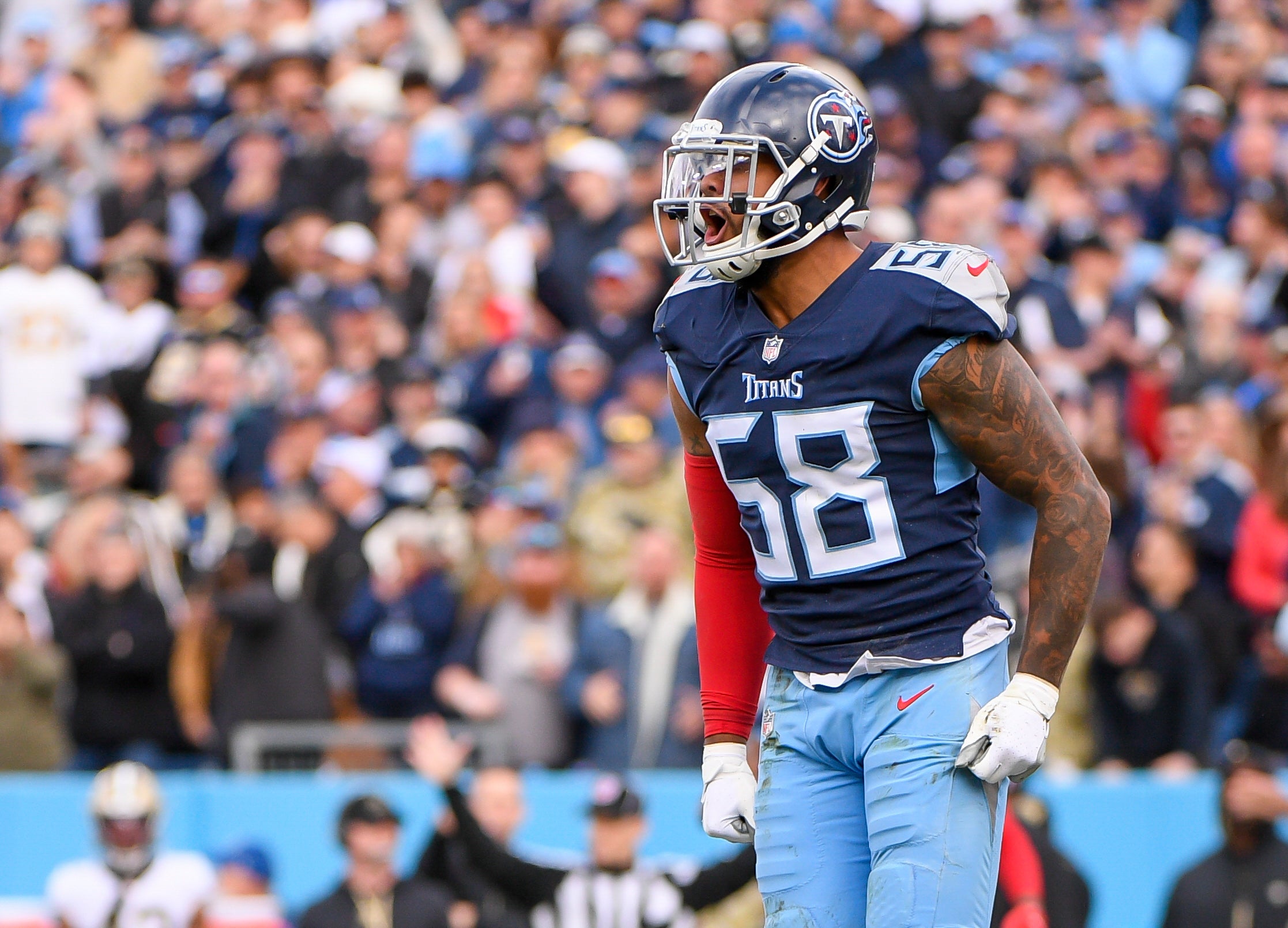 Nov 14, 2021; Nashville, Tennessee, USA;  Tennessee Titans linebacker Harold Landry (58) celebrates the tackle for loss against the New Orleans Saints during the first half at Nissan Stadium. Mandatory Credit: Steve Roberts-USA TODAY Sports