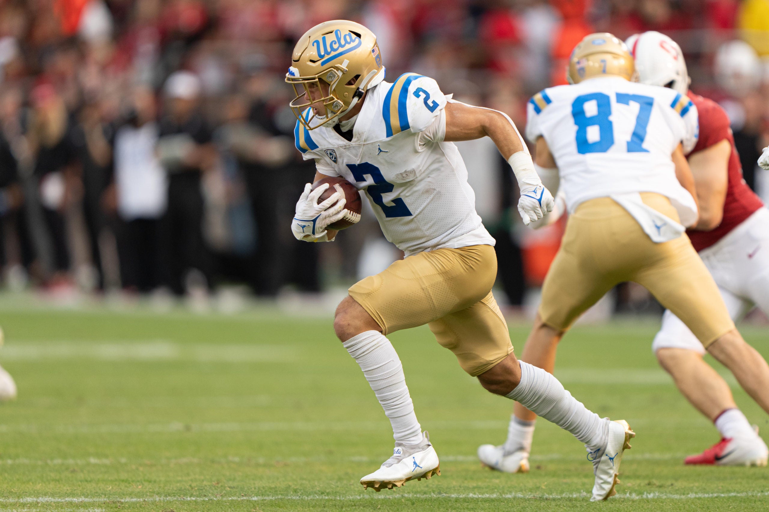 Sep 25, 2021; Stanford, California, USA; UCLA Bruins wide receiver Kyle Philips (2) runs with the football during the third quarter against the Stanford Cardinal at Stanford Stadium. Mandatory Credit: Stan Szeto-USA TODAY Sports