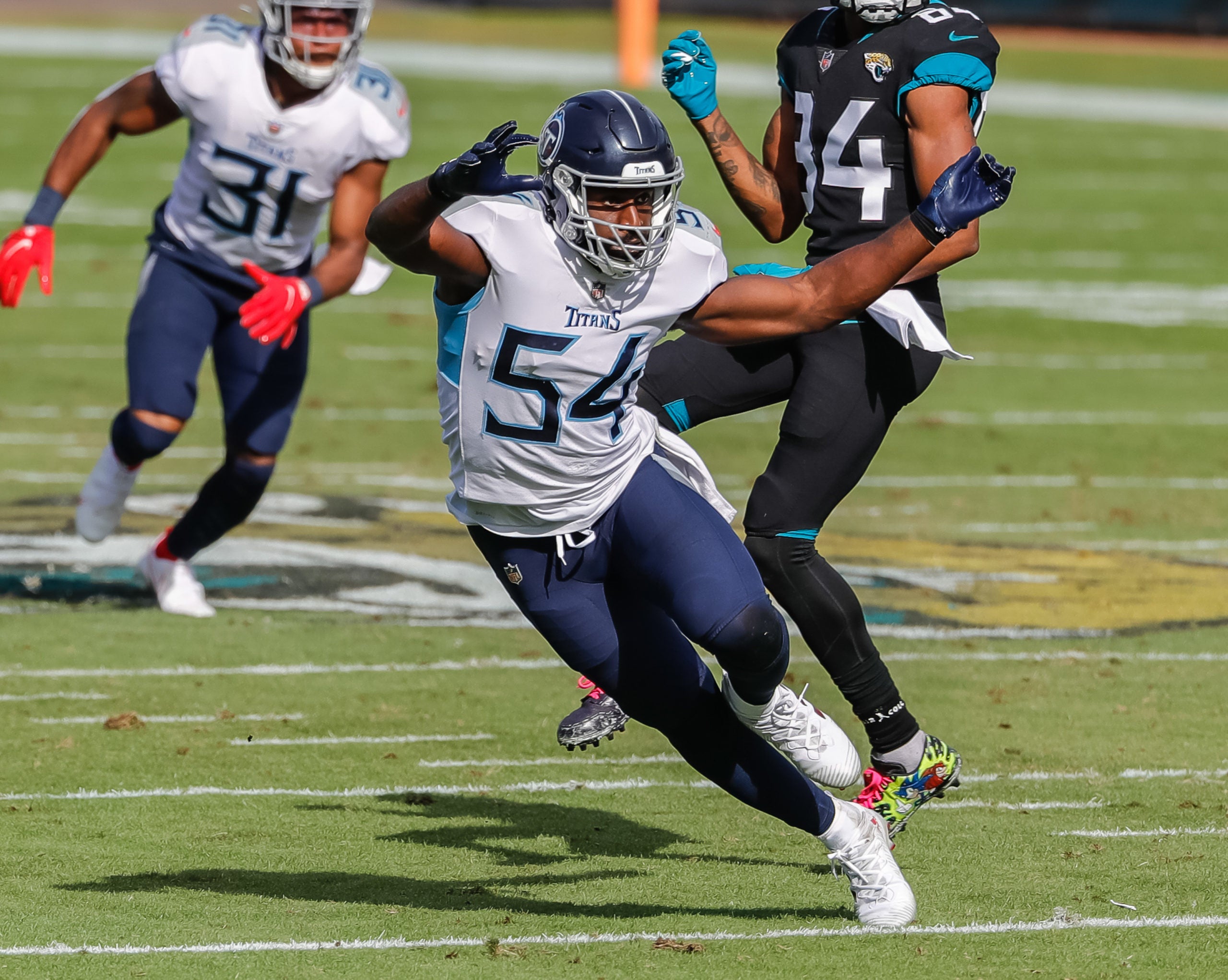 Dec 13, 2020; Jacksonville, Florida, USA; Tennessee Titans inside linebacker Rashaan Evans (54) heads off a Jacksonville Jaguars player during the second quarter at TIAA Bank Field. Mandatory Credit: Mike Watters-USA TODAY Sports