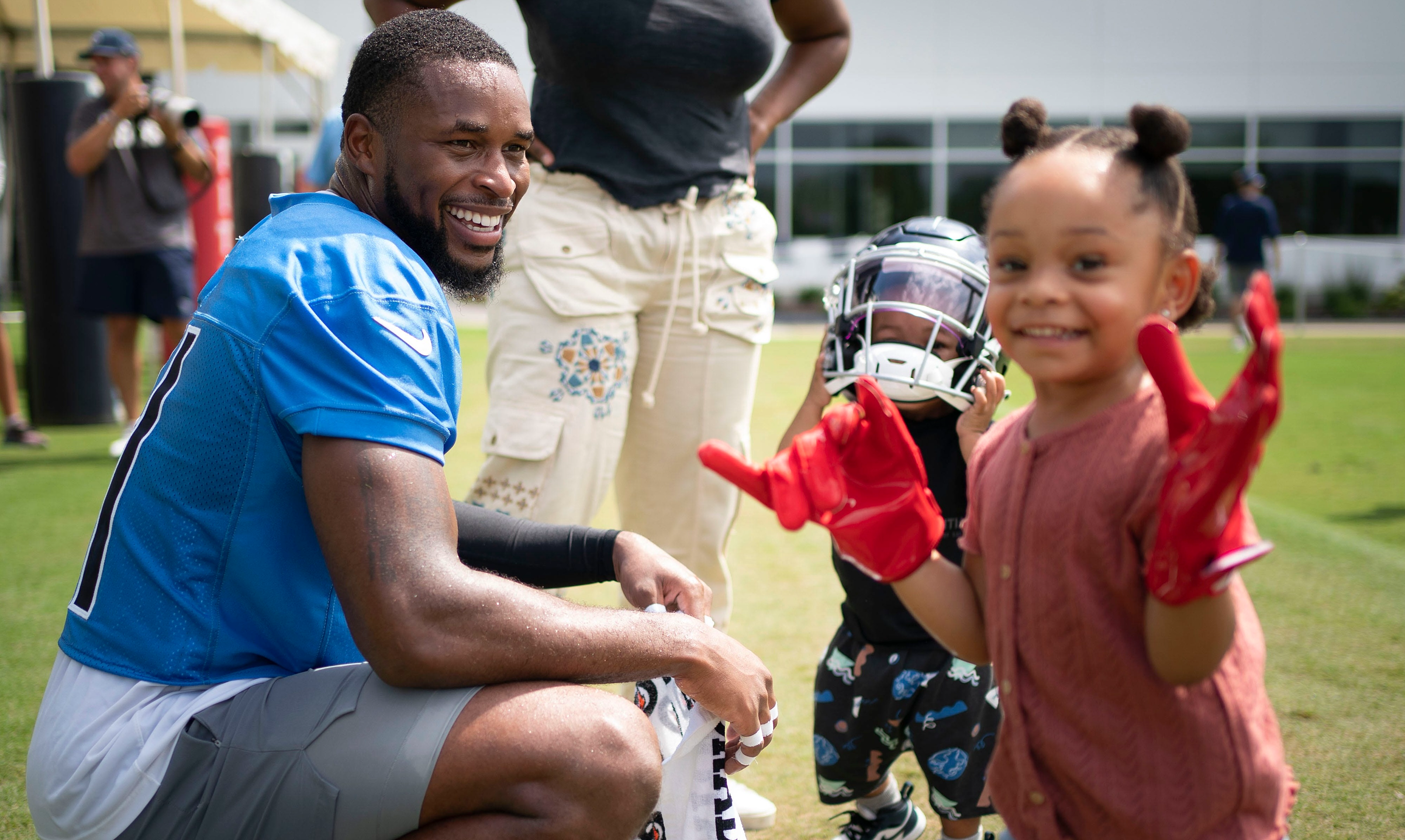 Tennessee Titans free safety Kevin Byard (31) spends time with his children Eliana and Kevin after a training camp practice at Saint Thomas Sports Park Wednesday, July 27, 2022, in Nashville, Tenn. Nas 0727 Titans 034