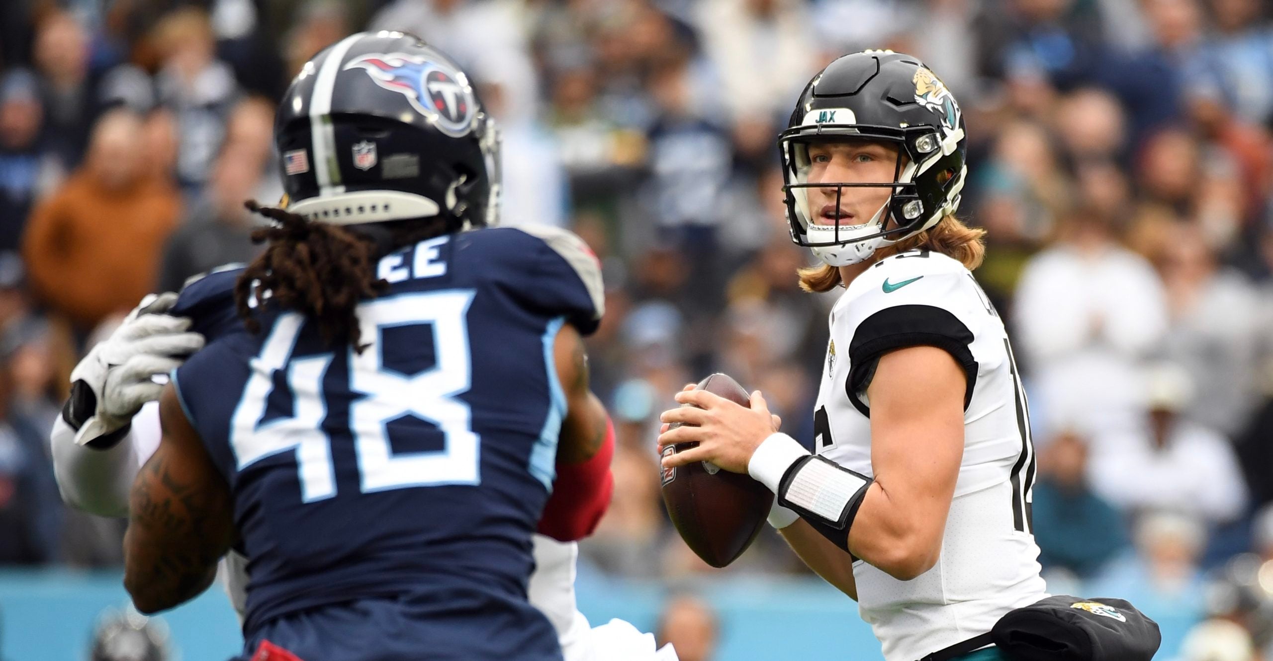 Dec 11, 2022; Nashville, Tennessee, USA; Jacksonville Jaguars quarterback Trevor Lawrence (16) drops back to pass during the first half against the Tennessee Titans at Nissan Stadium. Mandatory Credit: Christopher Hanewinckel-USA TODAY Sports