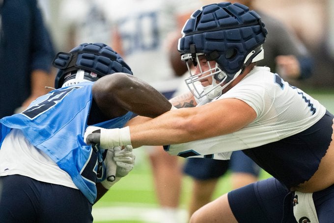 Tennessee Titans Dillon Radunz progress offensive line coach offensive coordinator Todd Downing Keith Carter starting right tackle stats draft second round practice training camp