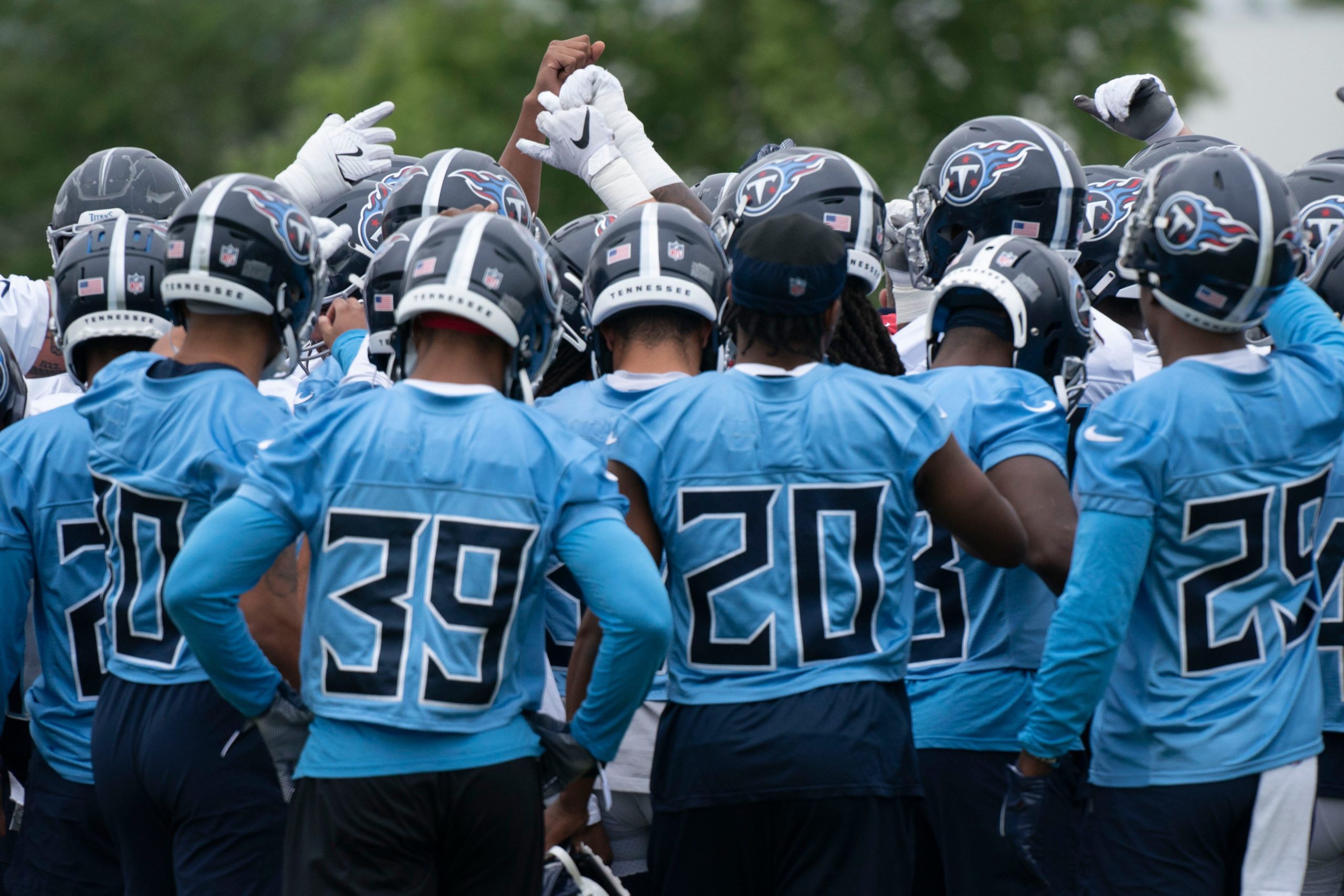 Tennessee Titans huddle during practice at Saint Thomas Sports Park Tuesday, May 24, 2022, in Nashville, Tenn. Nas Titans Ota 003