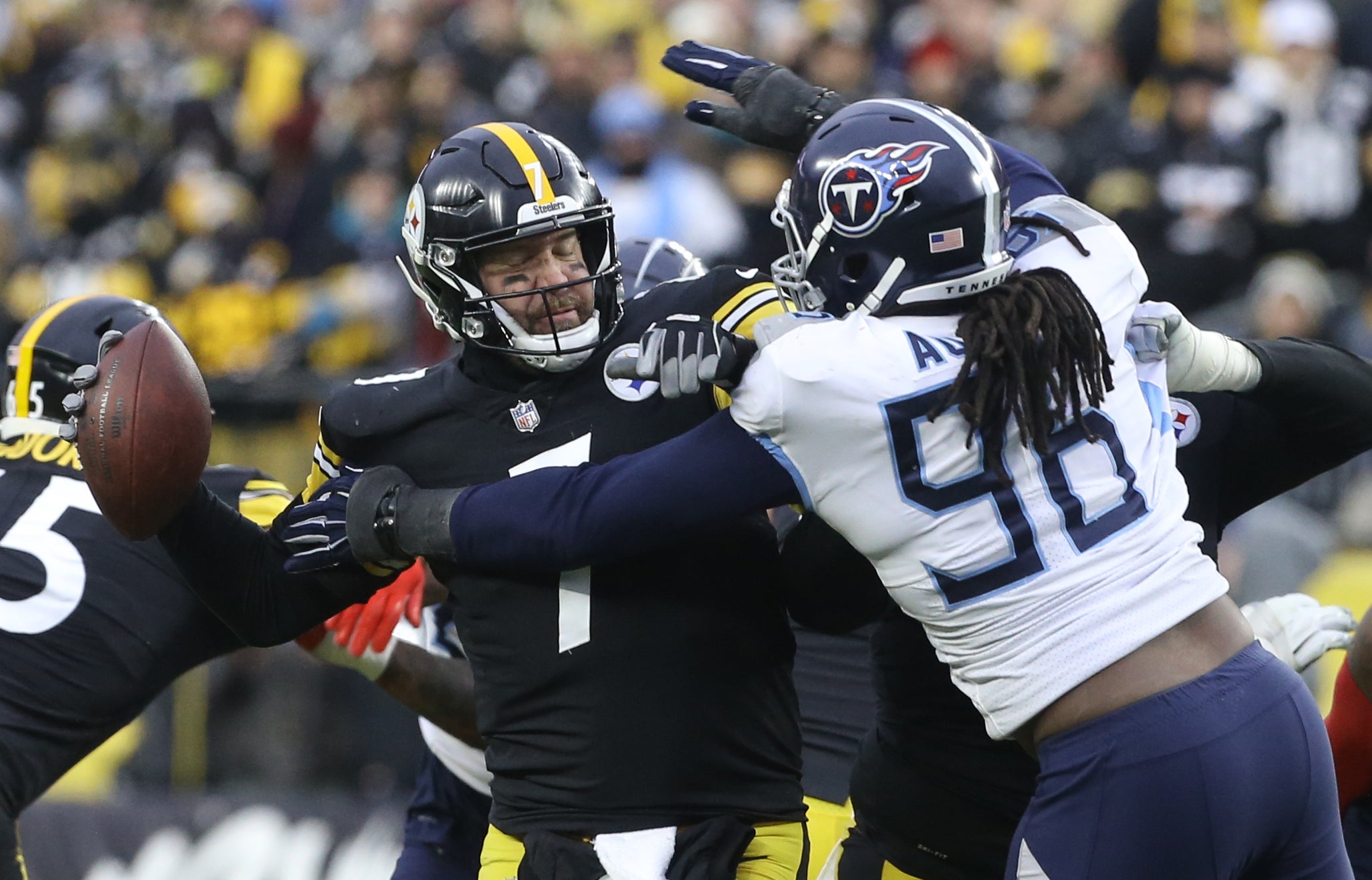 Dec 19, 2021; Pittsburgh, Pennsylvania, USA;  Tennessee Titans defensive end Denico Autry (96) pressures Pittsburgh Steelers quarterback Ben Roethlisberger (7) during the fourth quarter at Heinz Field. The Steelers won 19-13. Mandatory Credit: Charles LeClaire-USA TODAY Sports