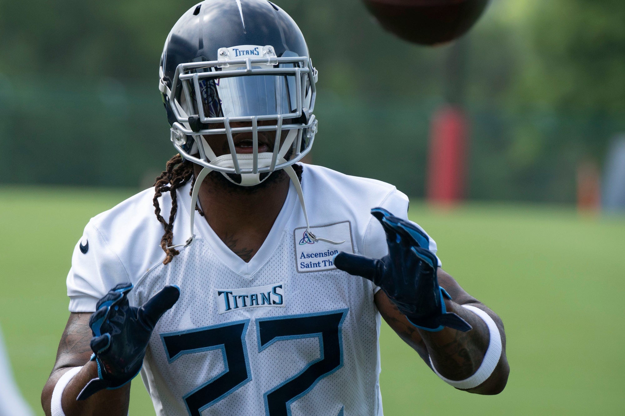 Tennessee Titans running back Derrick Henry (22) pulls in a catch during practice at Saint Thomas Sports Park Tuesday, June 14, 2022, in Nashville, Tenn.