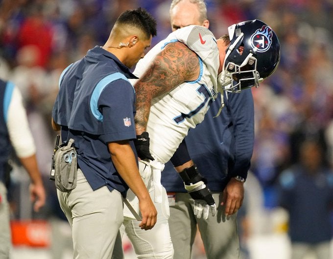 Tennessee Titans Taylor Lewan injured ACL right knee injury left tackle replacement free agents Jon Robinson Ereck Flowers Eric Fisher Nicholas Petit-Freire Dillon Radunz Dennis Daley