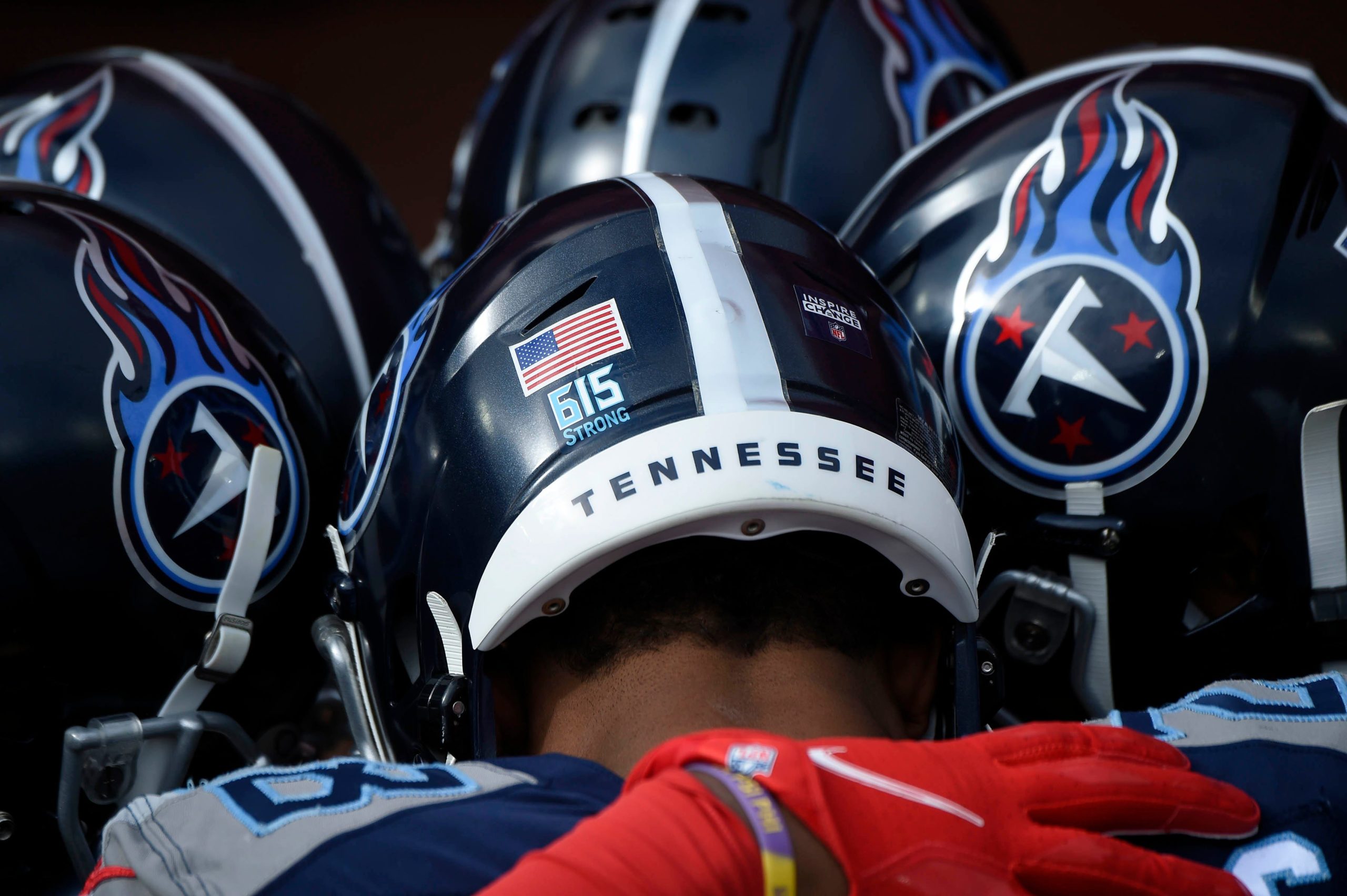 Titans players wear a "615 Strong" logo on their helmets as they face the Baltimore Ravens on January 10, 2021. The logo refers to Nashville's efforts to recover after the Christmas morning bombing. Titans Ravens 021