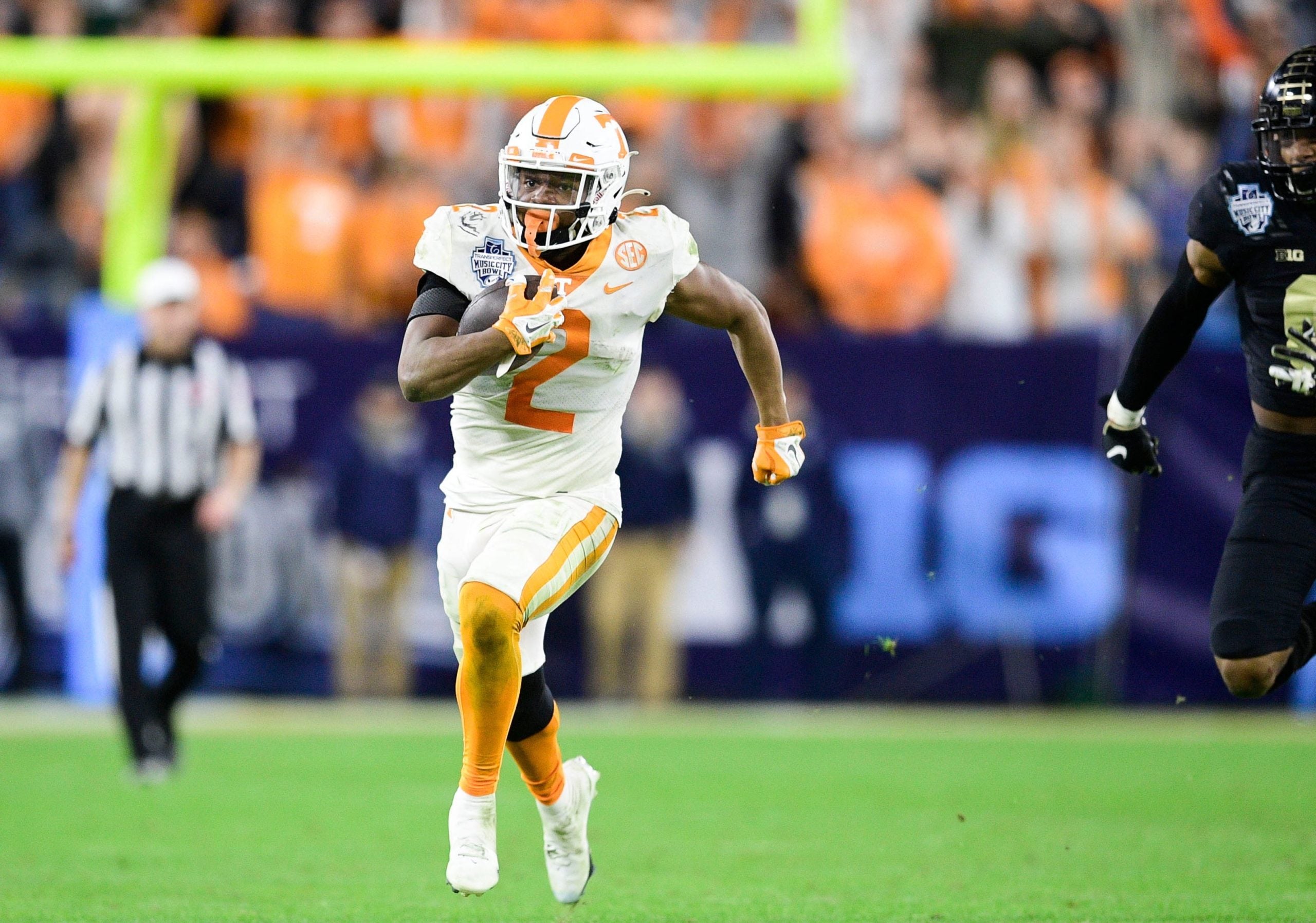 Tennessee running back Jabari Small (2) runs the ball down the field at the 2021 Music City Bowl NCAA college football game at Nissan Stadium in Nashville, Tenn. on Thursday, Dec. 30, 2021. Kns Tennessee Purdue
