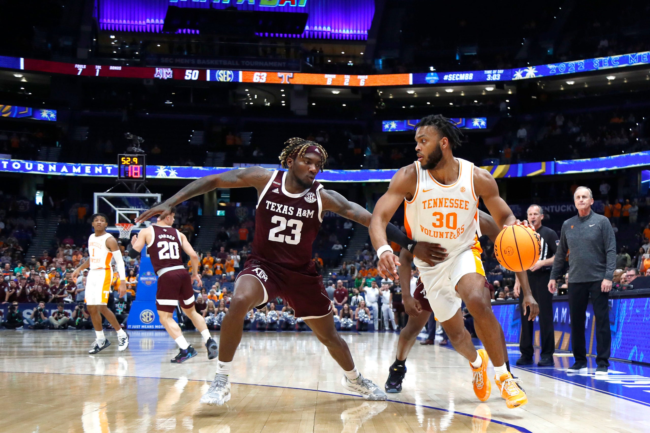 Mar 13, 2022; Tampa, FL, USA; Tennessee Volunteers guard Josiah-Jordan James (30) drives to the basket against Texas A&M Aggies guard Tyrece Radford (23) during the second half at Amalie Arena. Mandatory Credit: Kim Klement-USA TODAY Sports