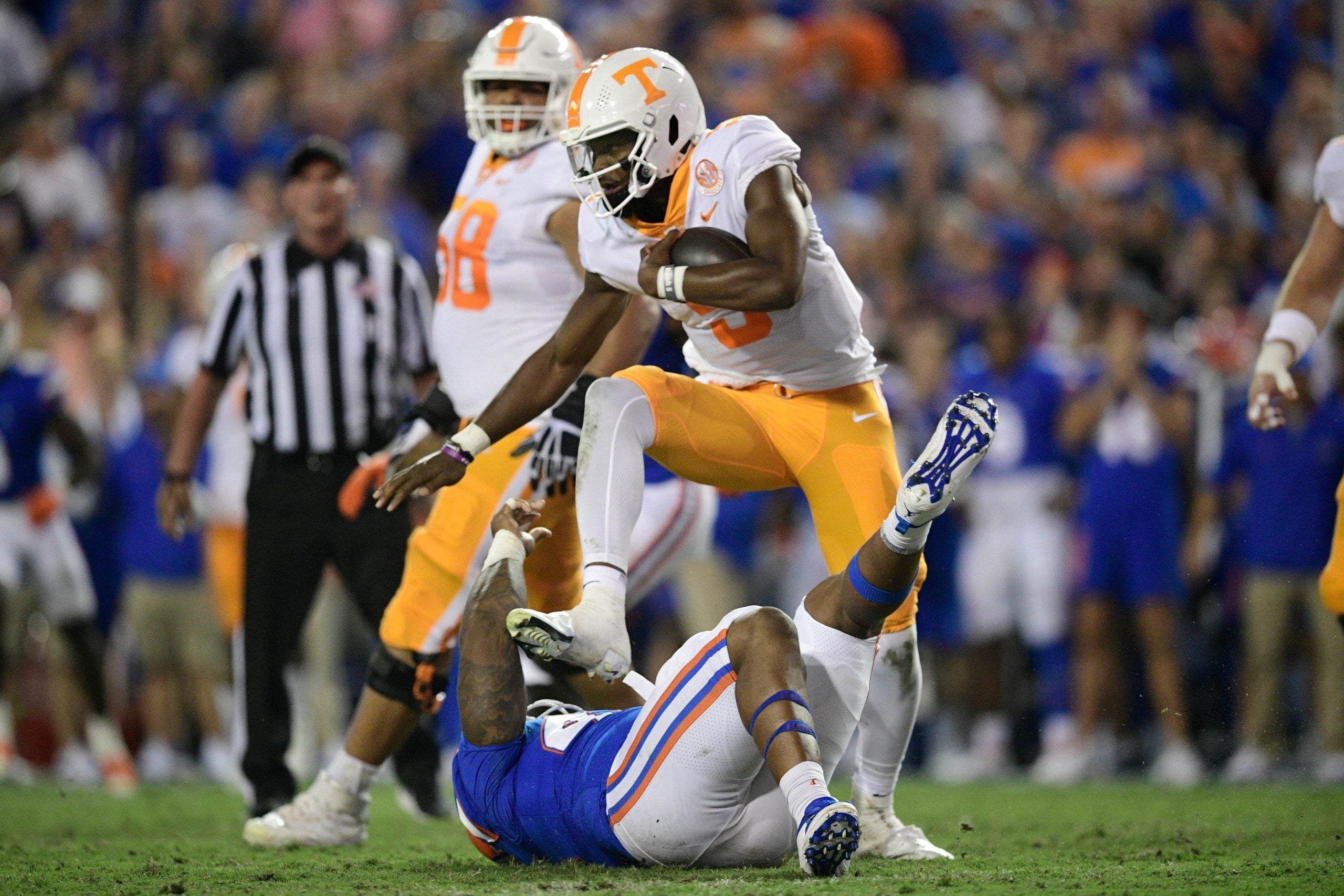 Tennessee quarterback Hendon Hooker (5) hurdles a player during the first quarter of an NCAA football game against Florida at Ben Hill Griffin Stadium in Gainesville, Florida on Saturday, Sept. 25, 2021. Tennflorida0925 0853